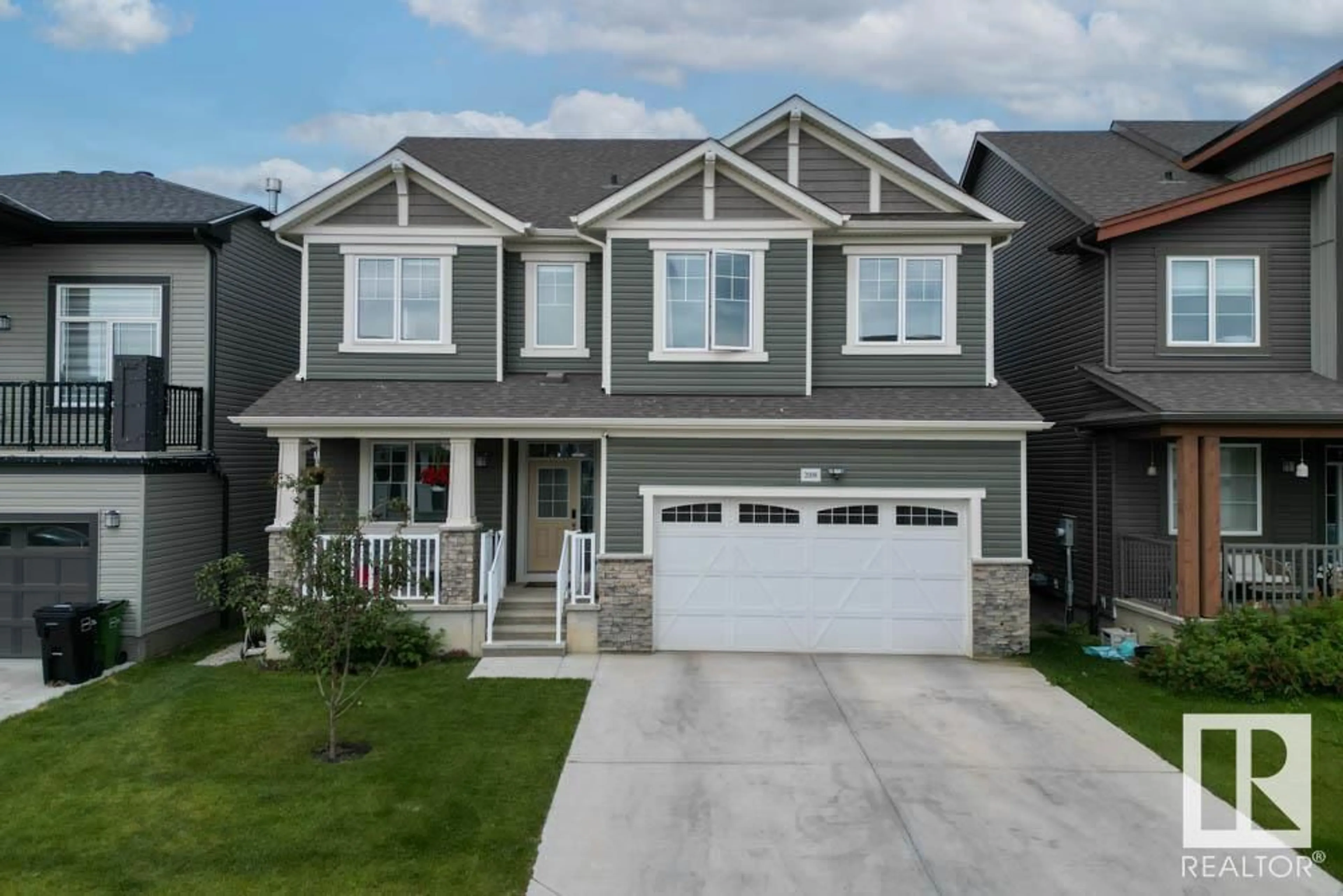 Home with vinyl exterior material, street for NW - 2008 206 ST, Edmonton Alberta T6M1M7