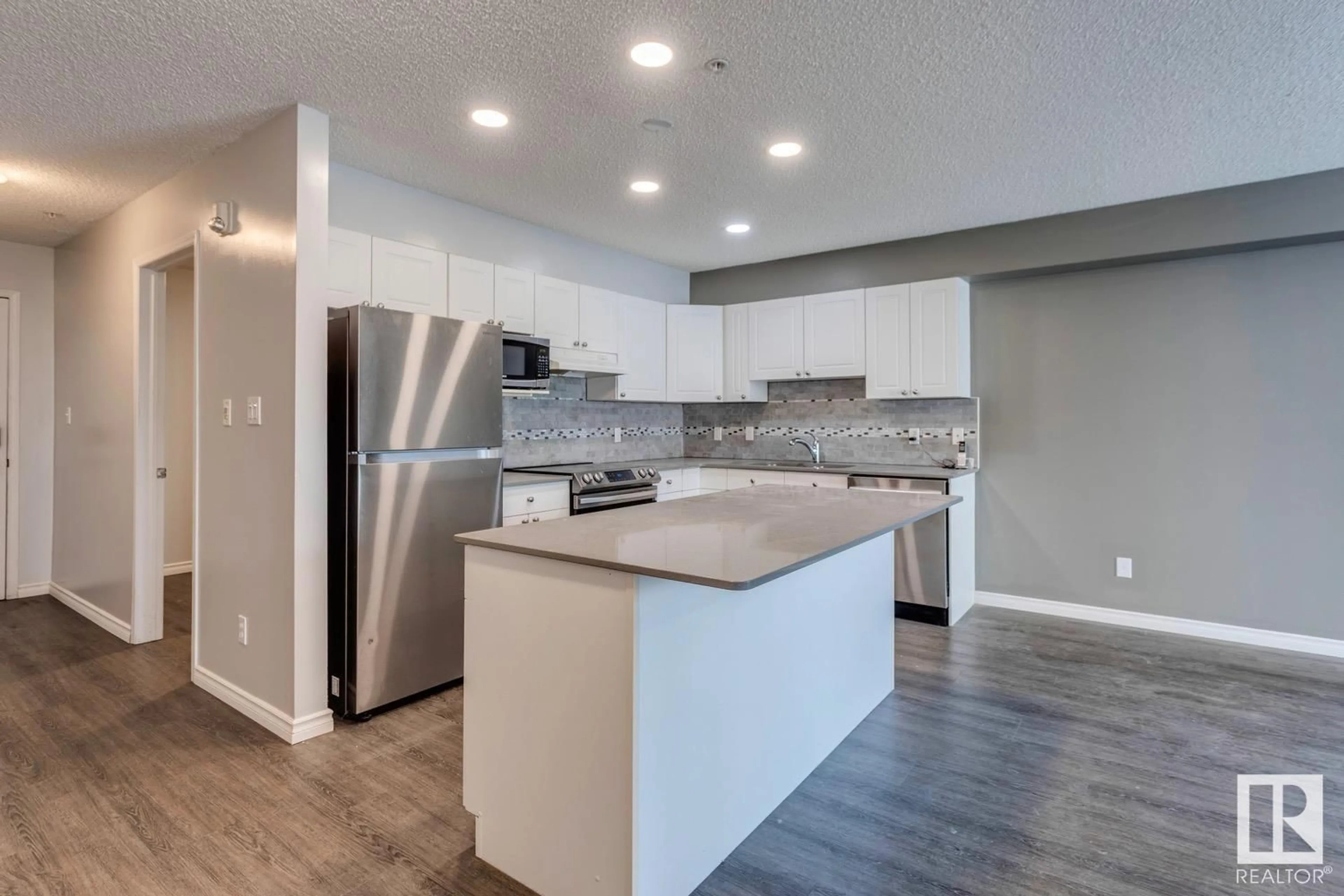 Open concept kitchen, unknown for 300 10311 111 ST NW, Edmonton Alberta T5K2Y8