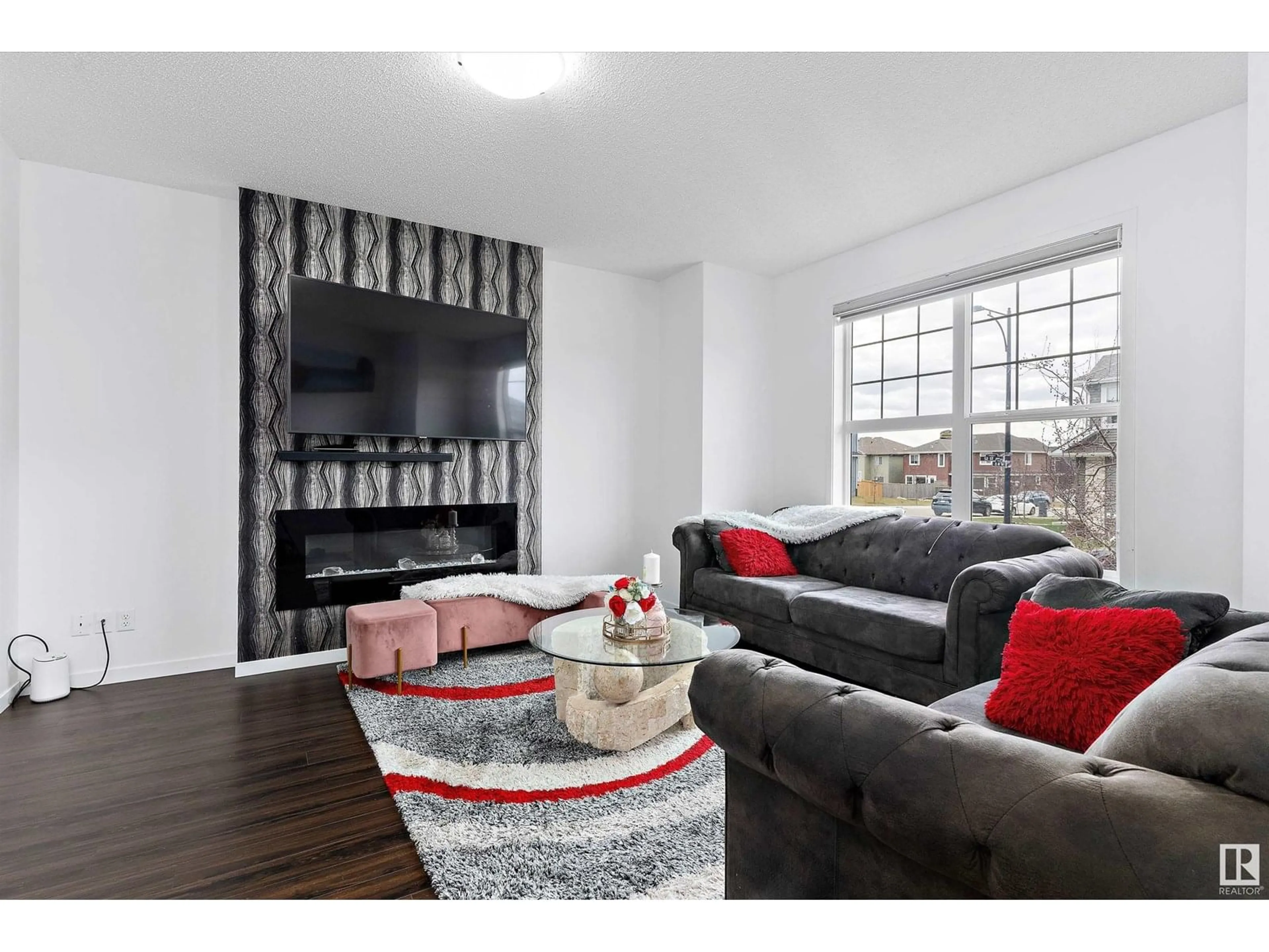 Living room with furniture, wood/laminate floor for SW - 2031 52 ST, Edmonton Alberta T6X1Z7
