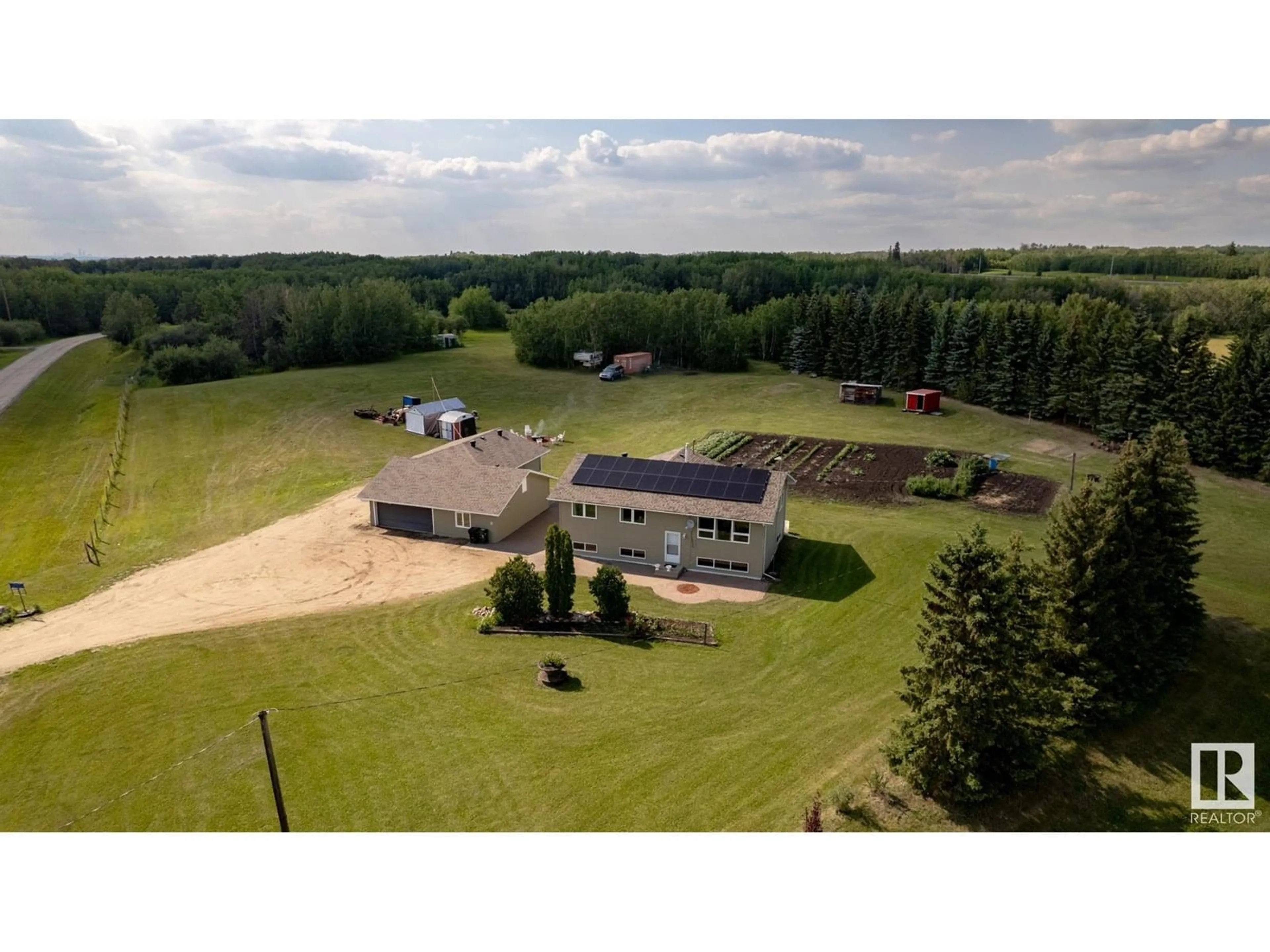 A pic from outside/outdoor area/front of a property/back of a property/a pic from drone, building for 14 - 53158 RGE ROAD 215, Rural Strathcona County Alberta T0B0E0