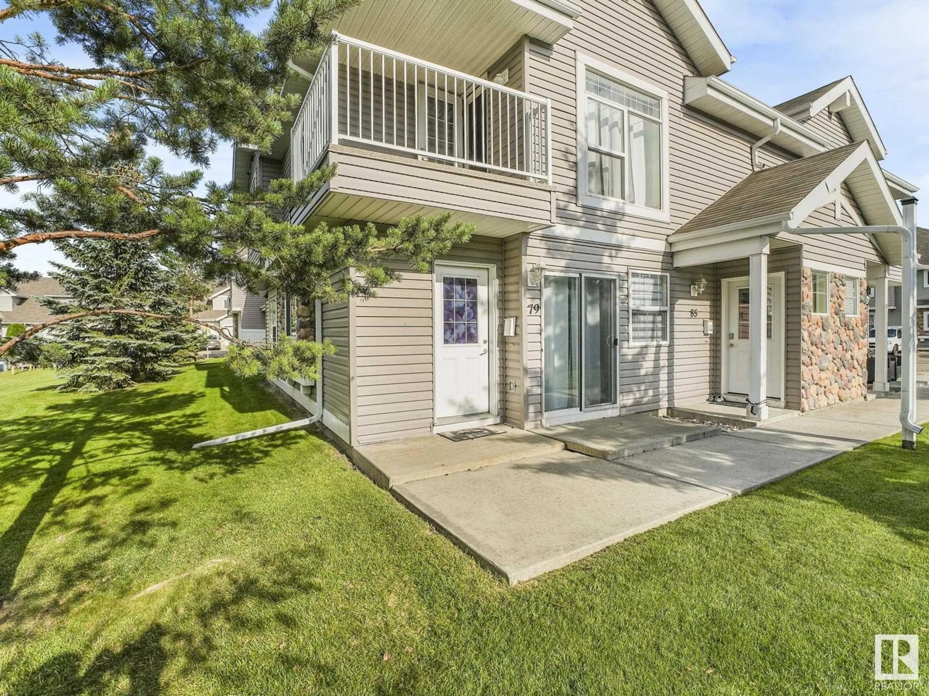 Home with vinyl exterior material, street for 79 EDWARDS DR, Edmonton Alberta T6X1M4