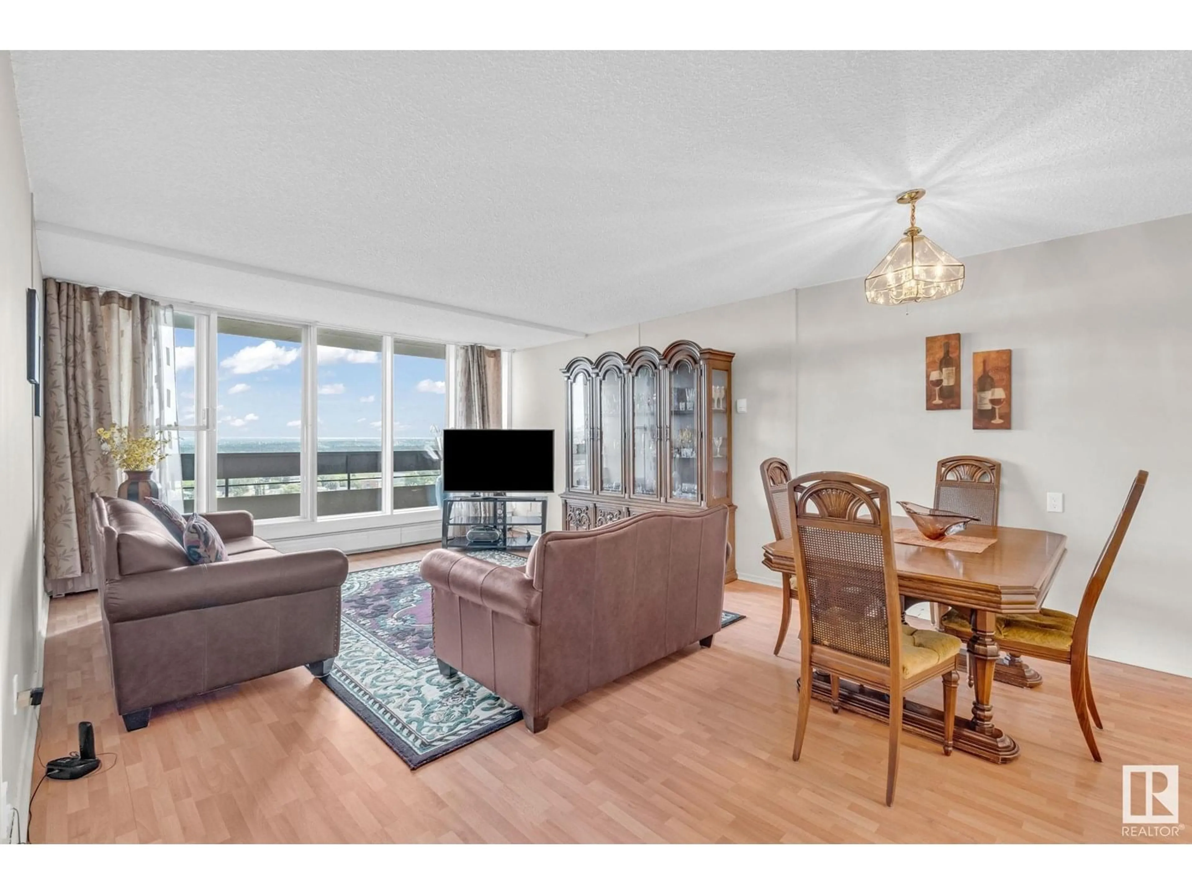 Living room with furniture, wood/laminate floor for 163 8735 165 ST NW, Edmonton Alberta T5R2R6