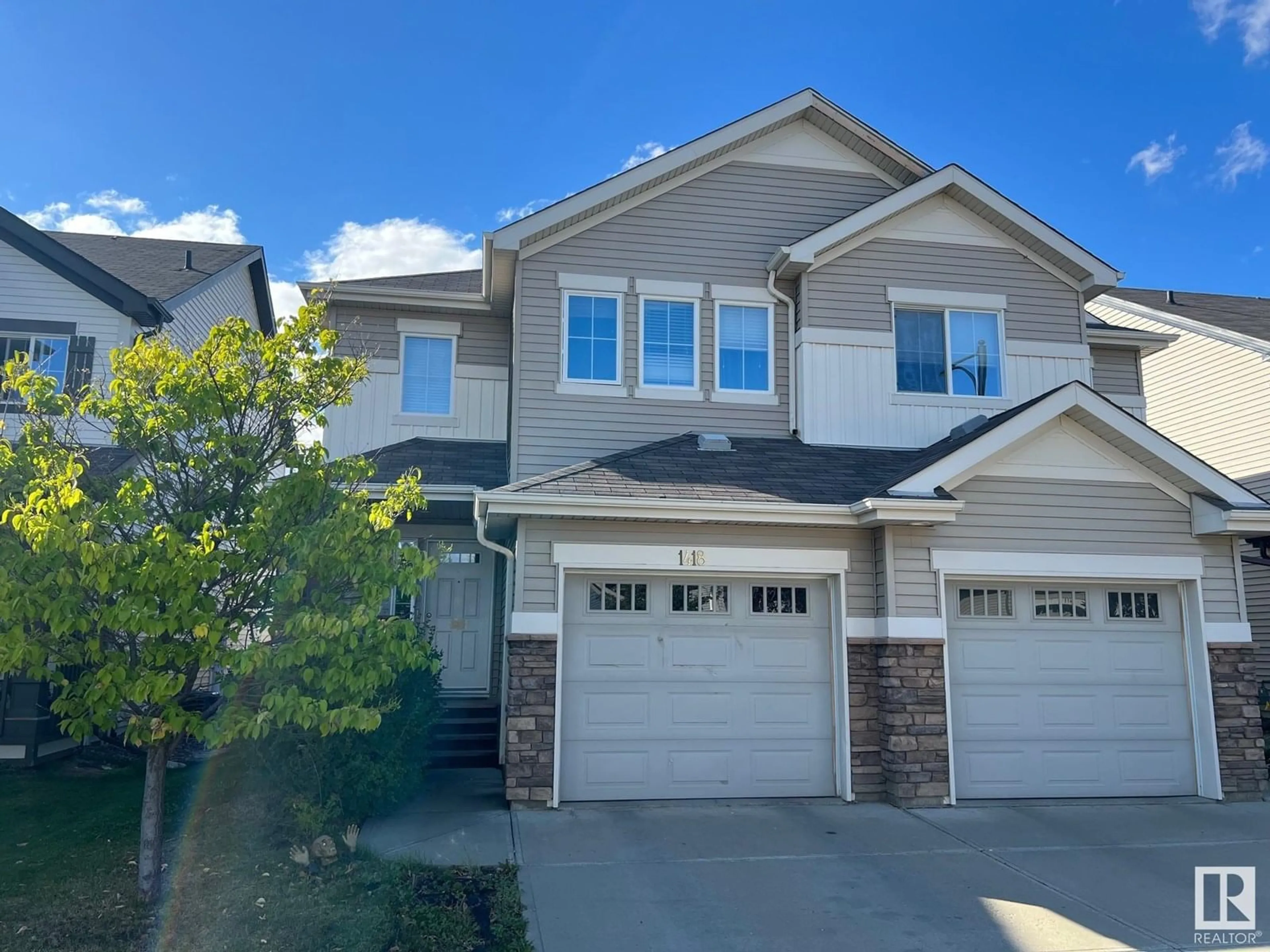 Home with vinyl exterior material, street for SW - 1418 60 ST, Edmonton Alberta T6X0V8