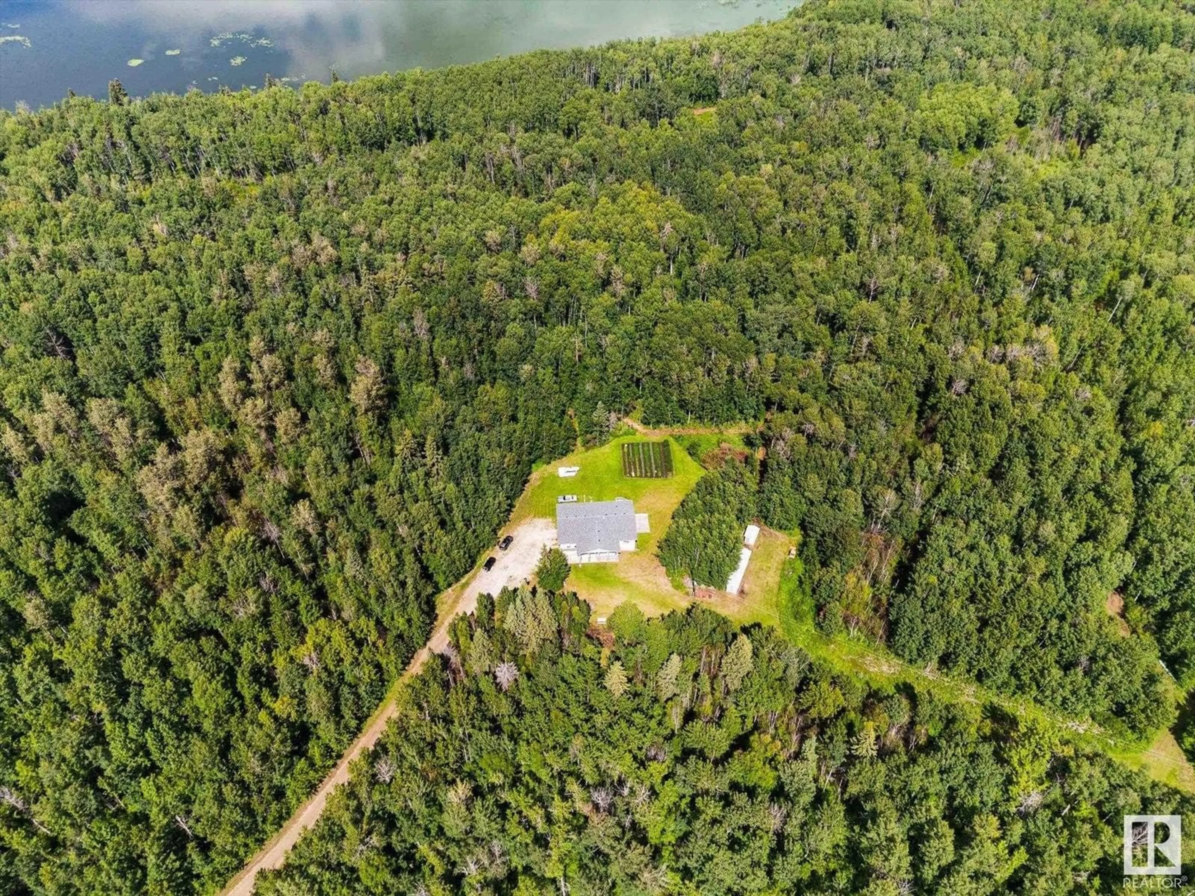 A pic from outside/outdoor area/front of a property/back of a property/a pic from drone, forest/trees view for 6316 HGHWAY 16, Rural Parkland County Alberta T0E0W0