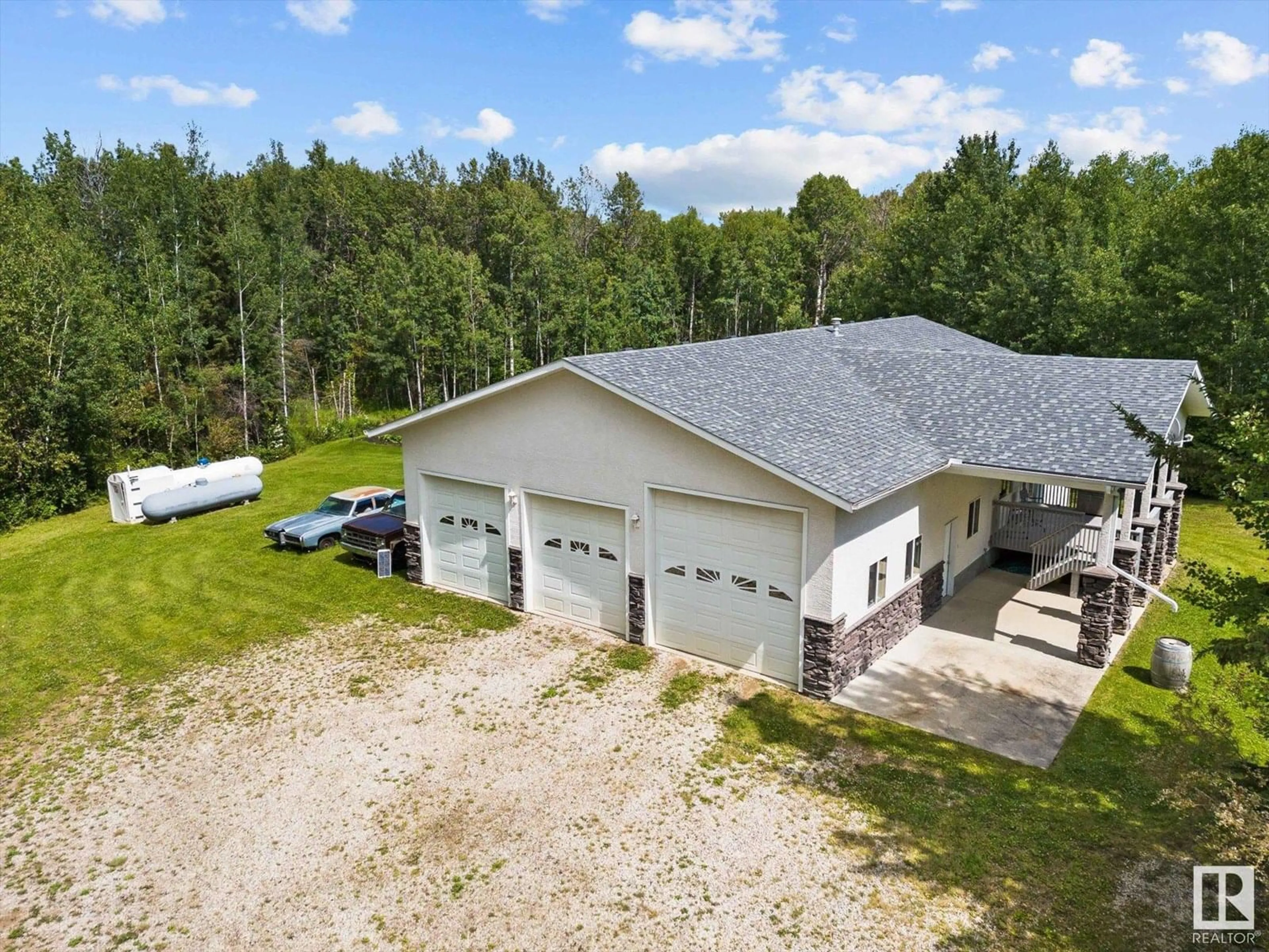 A pic from outside/outdoor area/front of a property/back of a property/a pic from drone, building for 6316 HGHWAY 16, Rural Parkland County Alberta T0E0W0
