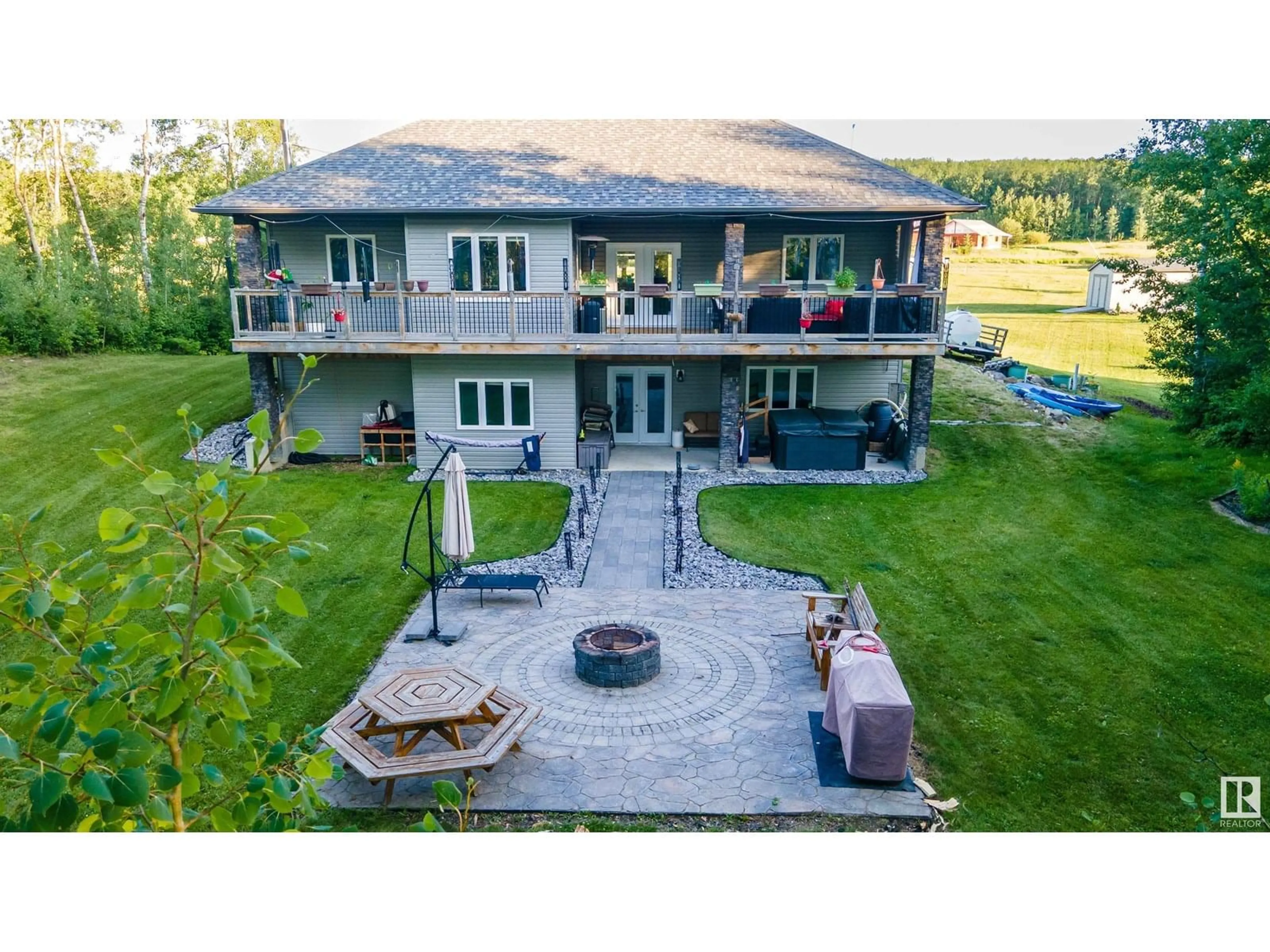 A pic from outside/outdoor area/front of a property/back of a property/a pic from drone, water/lake/river/ocean view for #4 - 54208 RGE ROAD 12, Rural Lac Ste. Anne County Alberta T0E1V2
