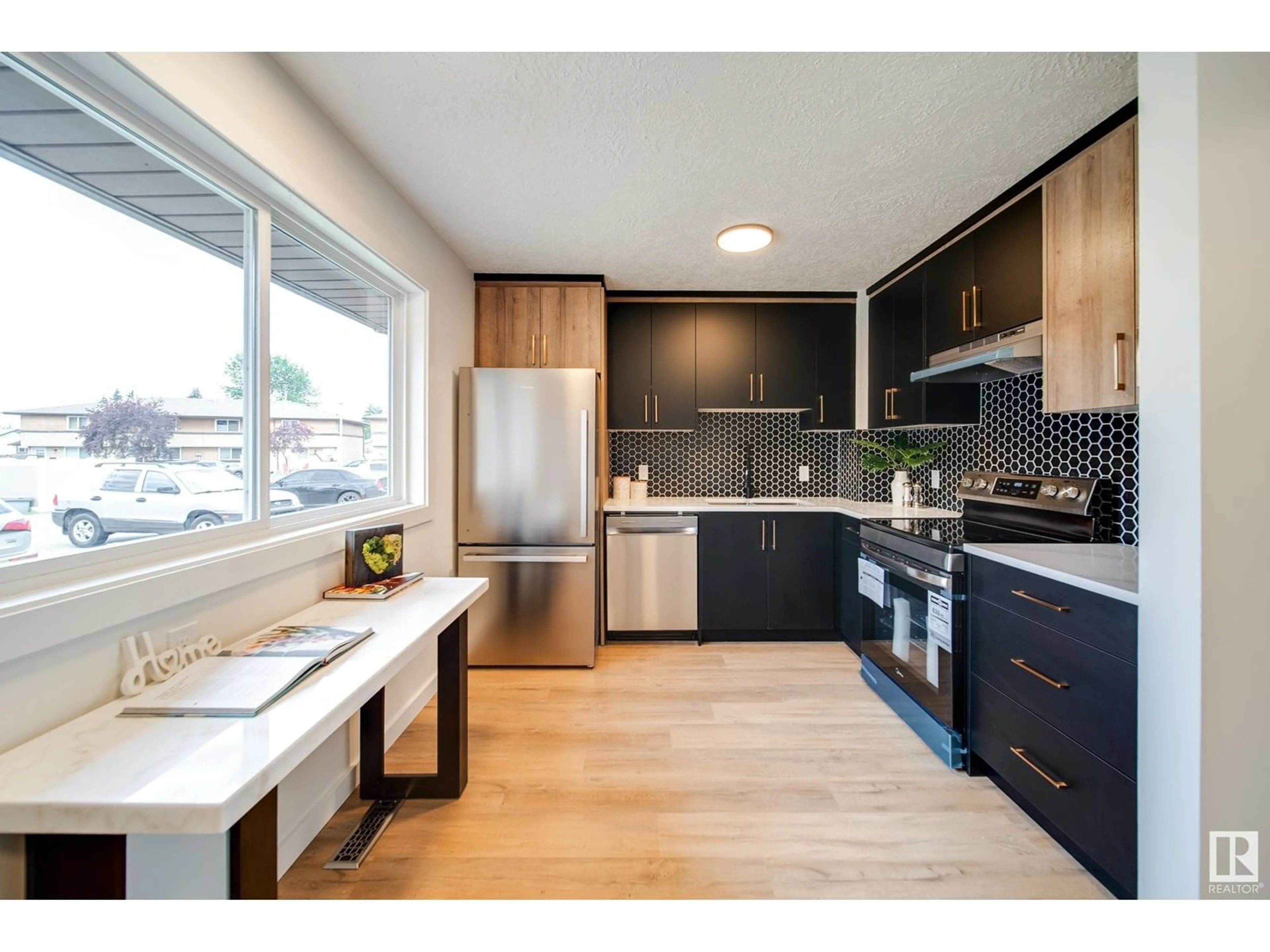 Open concept kitchen, wood/laminate floor for 117 WOODBOROUGH WY, Edmonton Alberta T5Y1N2