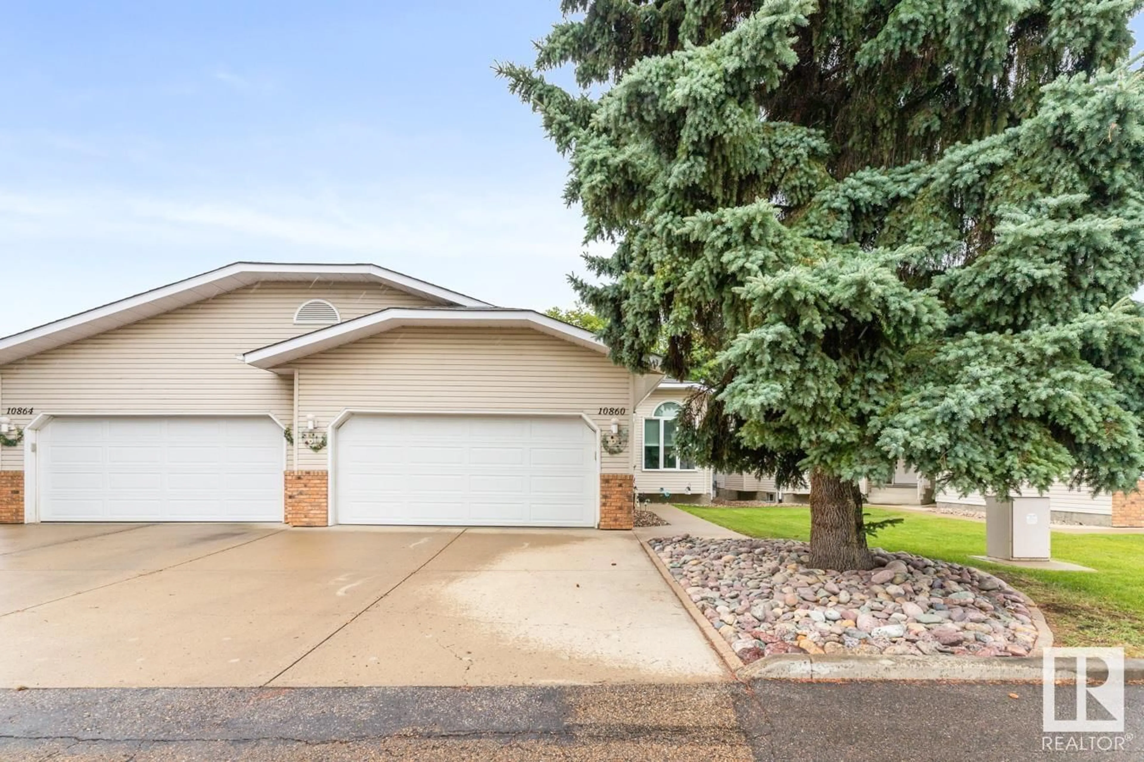 Home with vinyl exterior material, street for 10860 25 AV, Edmonton Alberta T6J6N5