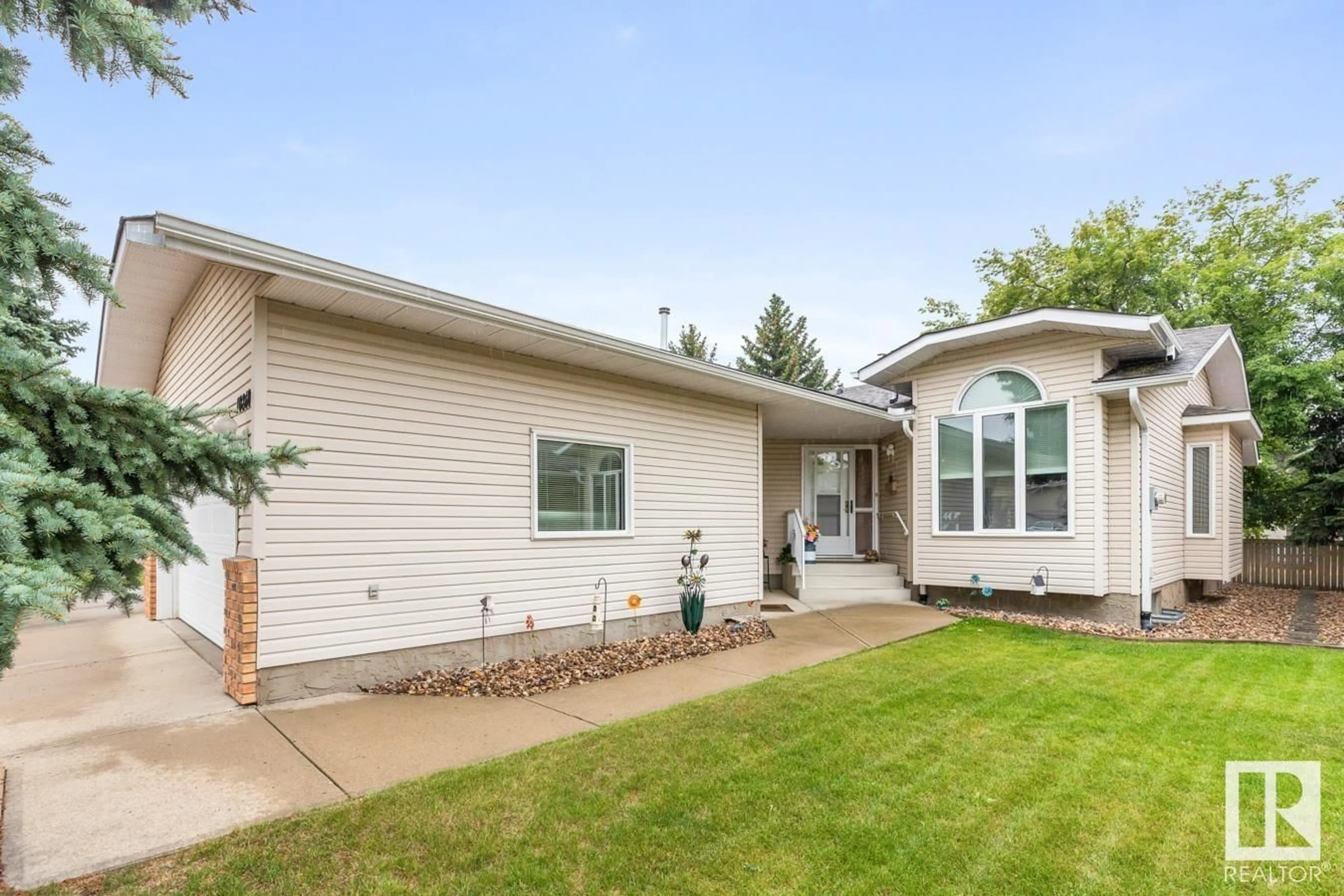 Home with vinyl exterior material, street for 10860 25 AV, Edmonton Alberta T6J6N5