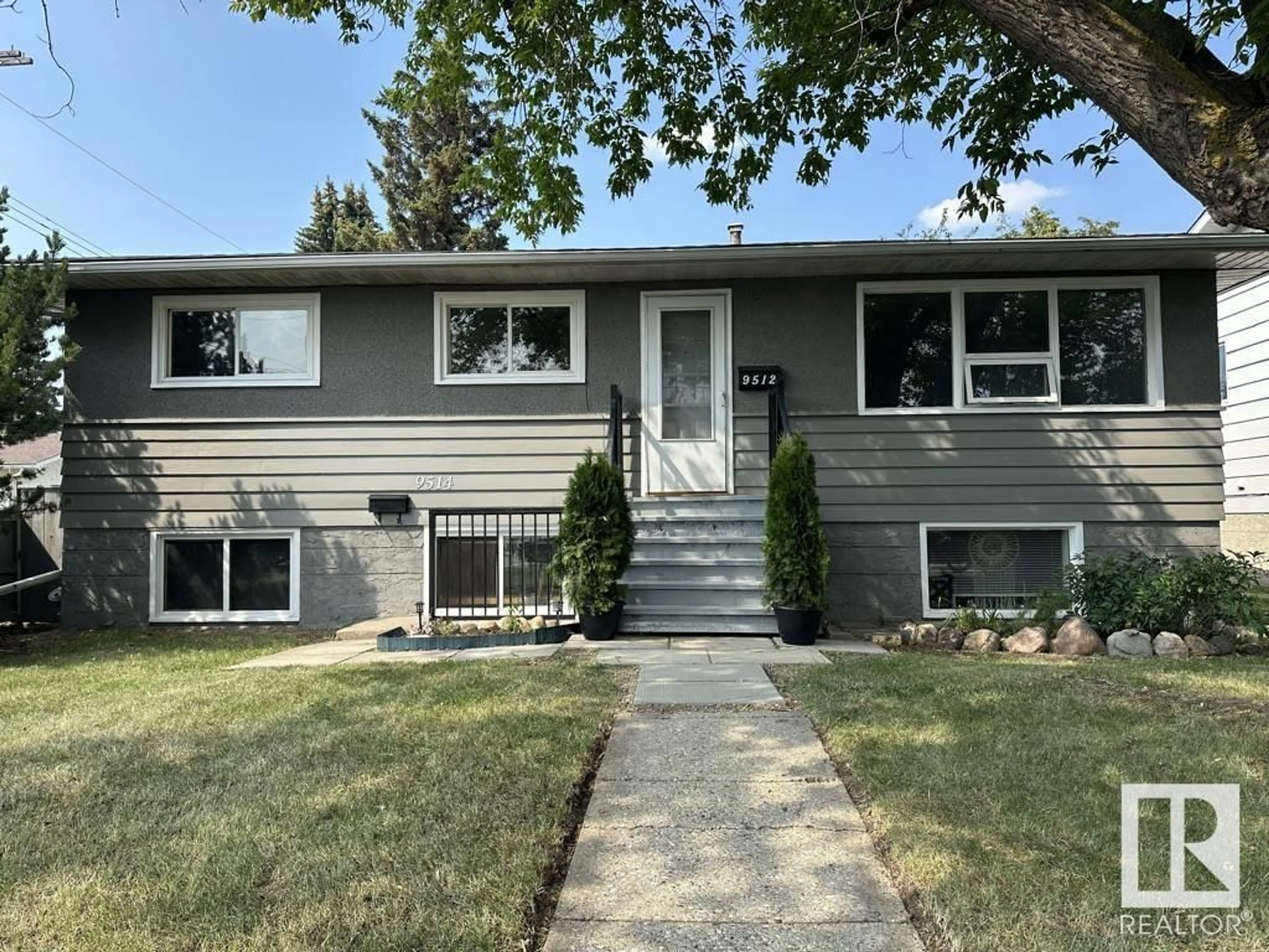 Home with vinyl exterior material, street for 9512/9514 128 AV, Edmonton Alberta T5E0H6