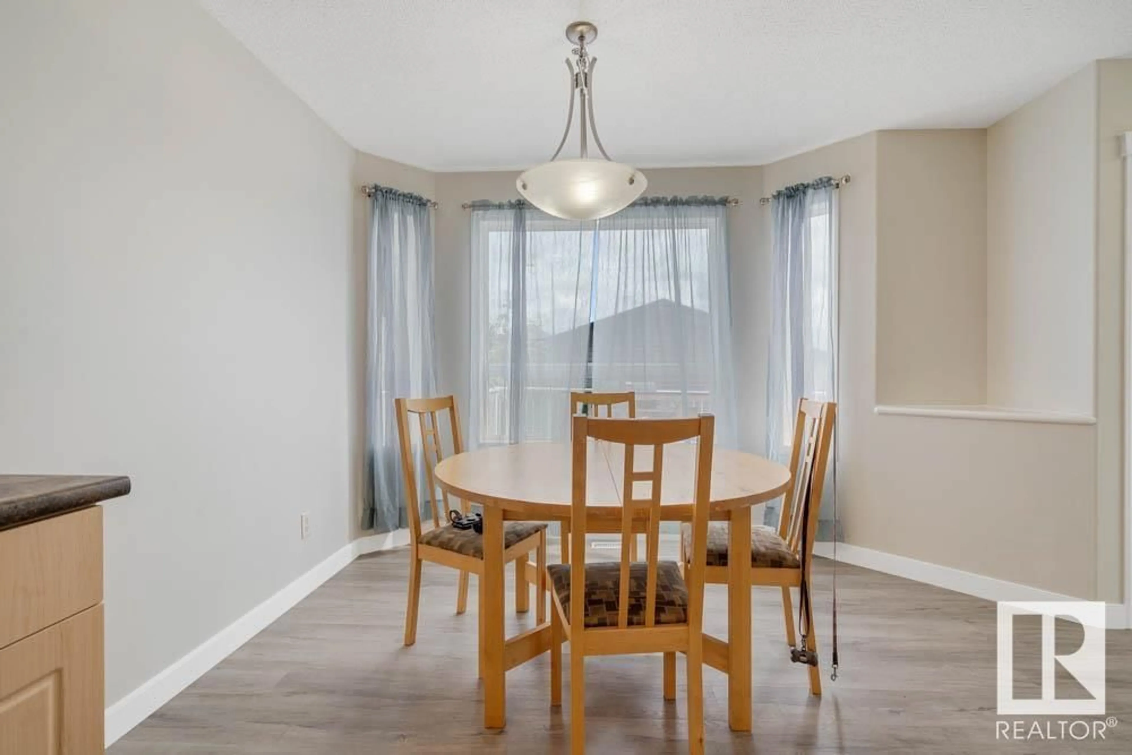 Dining room, wood/laminate floor for PM - 57 SUNTREE, Leduc Alberta T9E8R8