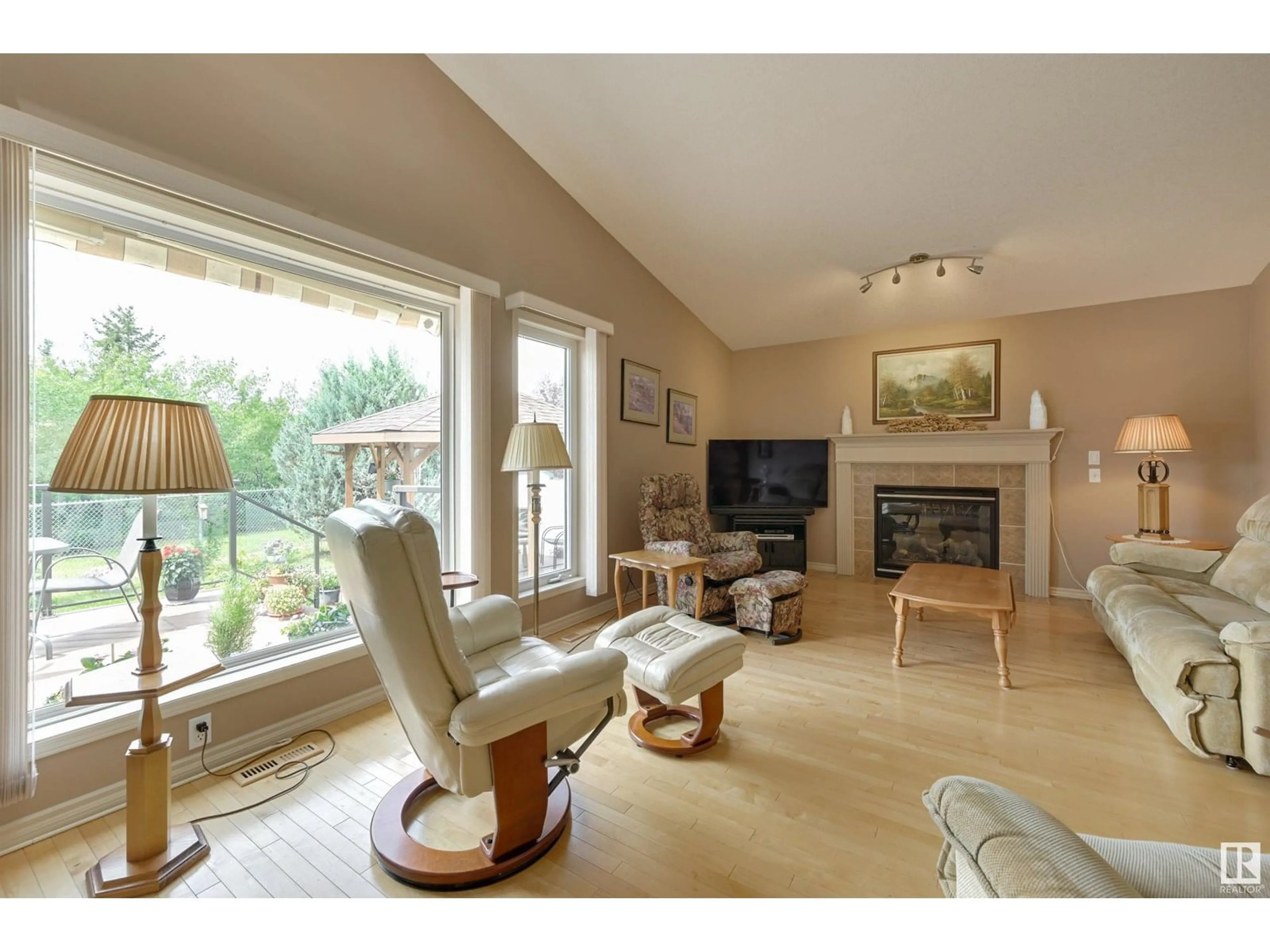 Living room with furniture, wood/laminate floor for NW - 13068 39 ST, Edmonton Alberta T5A4Y6