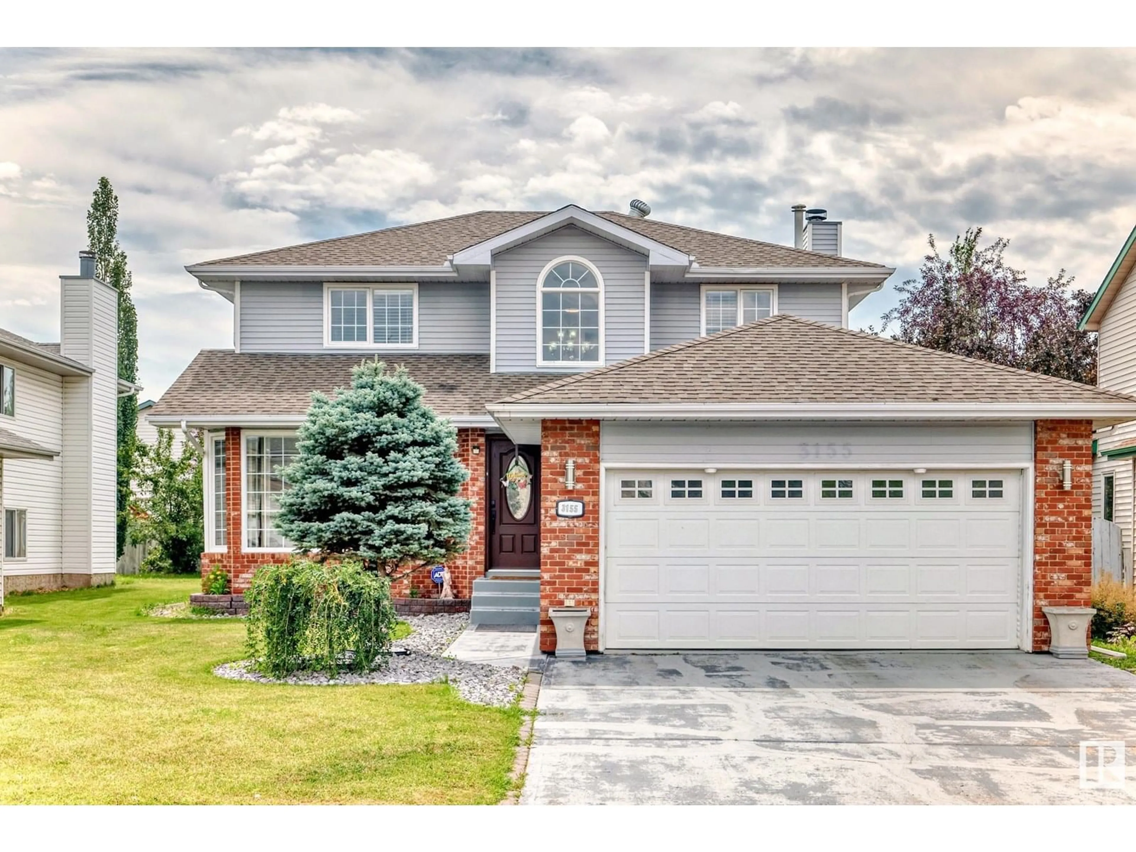Home with vinyl exterior material, street for 3155 36 AV, Edmonton Alberta T6T1H8