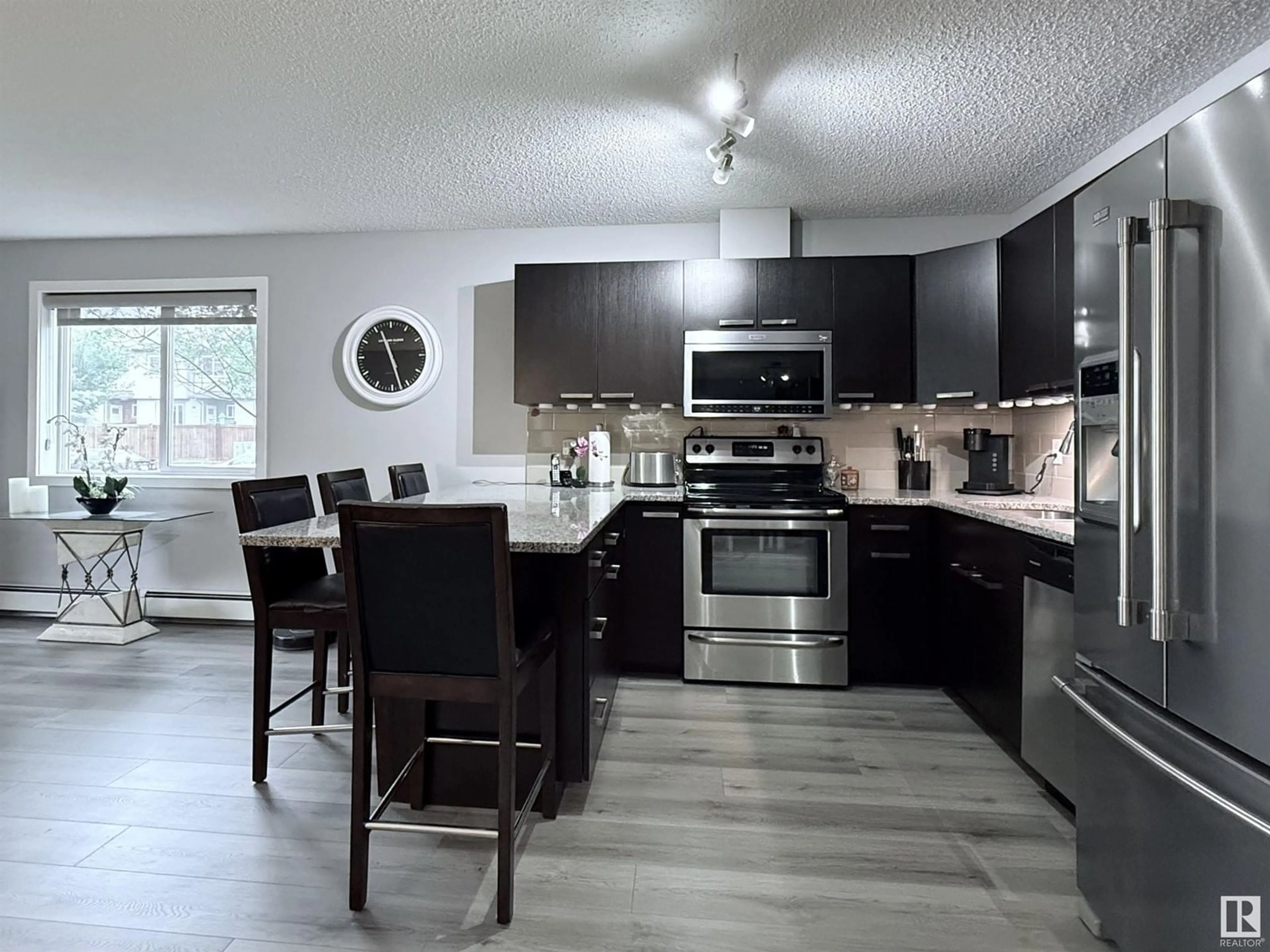 Open concept kitchen, unknown for #104 - 14808 125 ST, Edmonton Alberta T5X0G1
