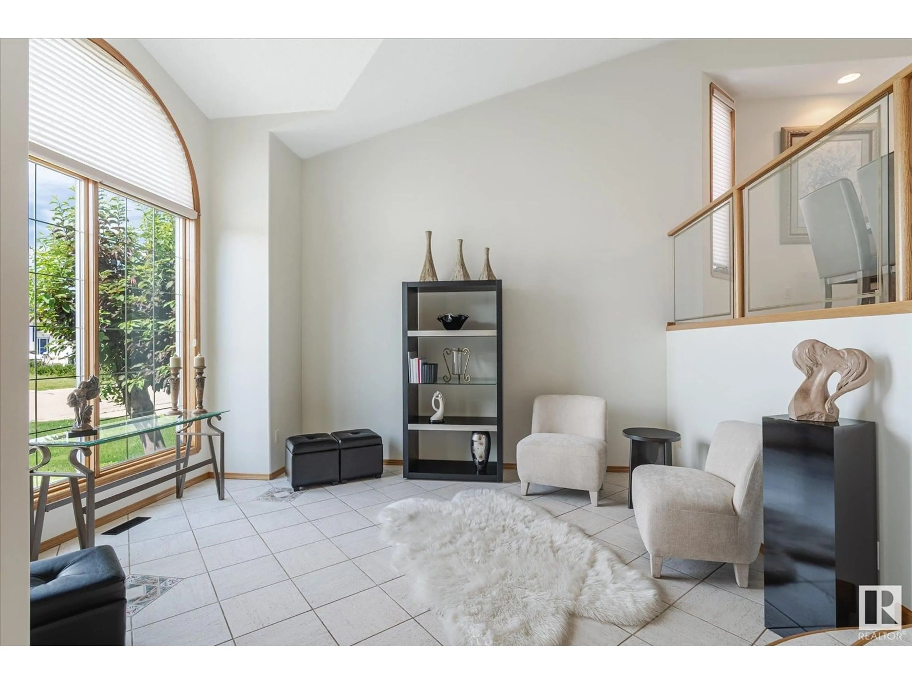 Living room with furniture, ceramic/tile floor for 15819 63 ST, Edmonton Alberta T5Y2R8