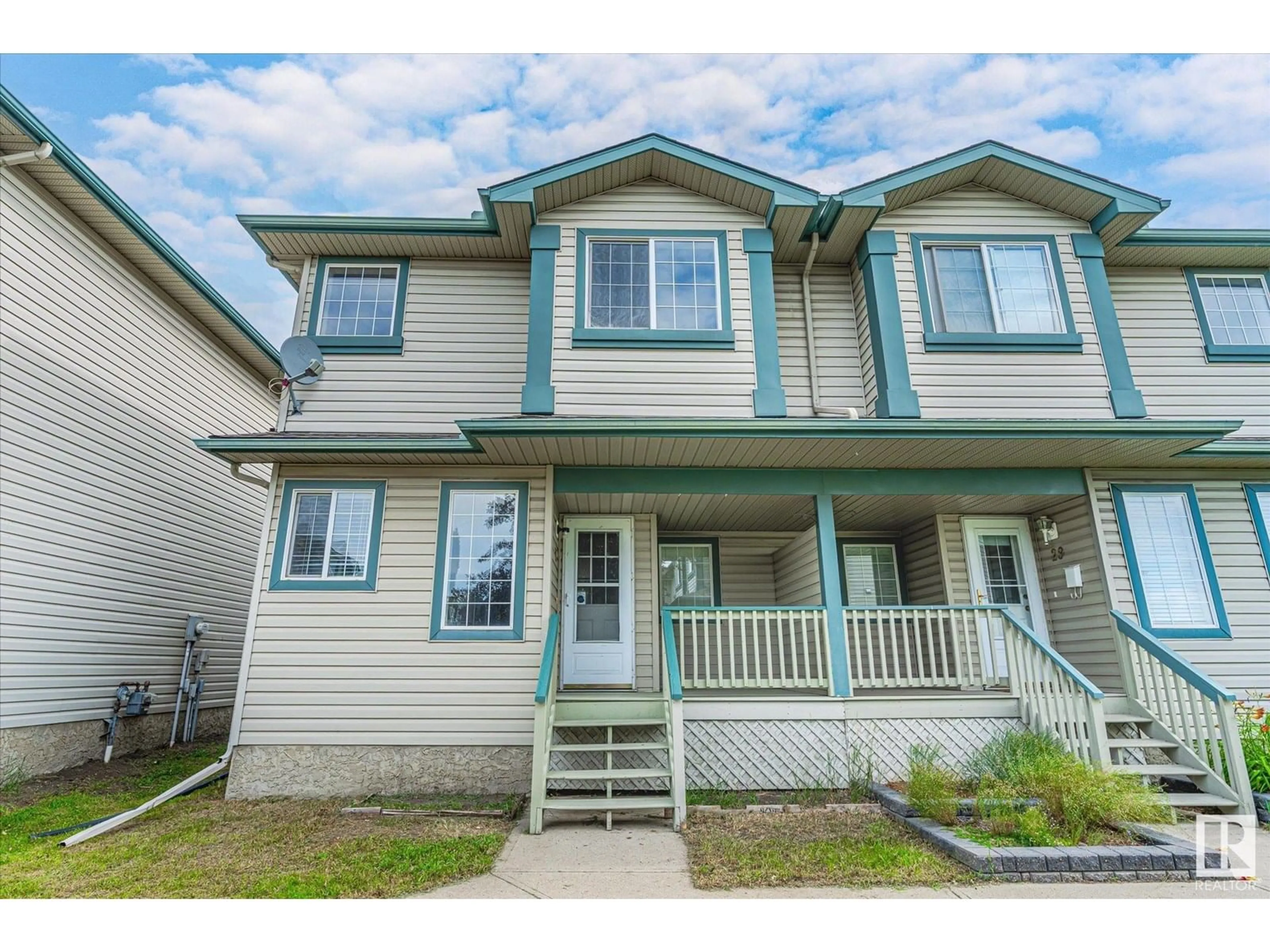 Home with vinyl exterior material, street for #30 - 14803 MILLER BV, Edmonton Alberta T5Y3A4