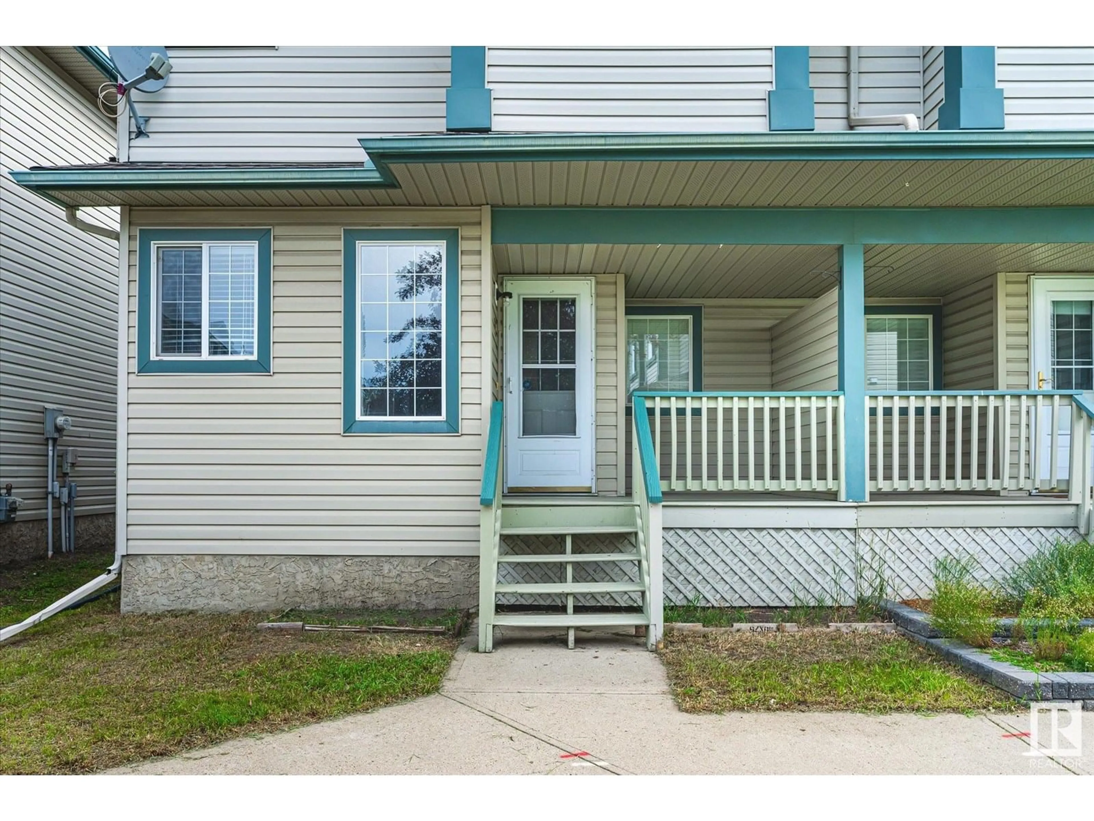 Home with vinyl exterior material, street for #30 - 14803 MILLER BV, Edmonton Alberta T5Y3A4