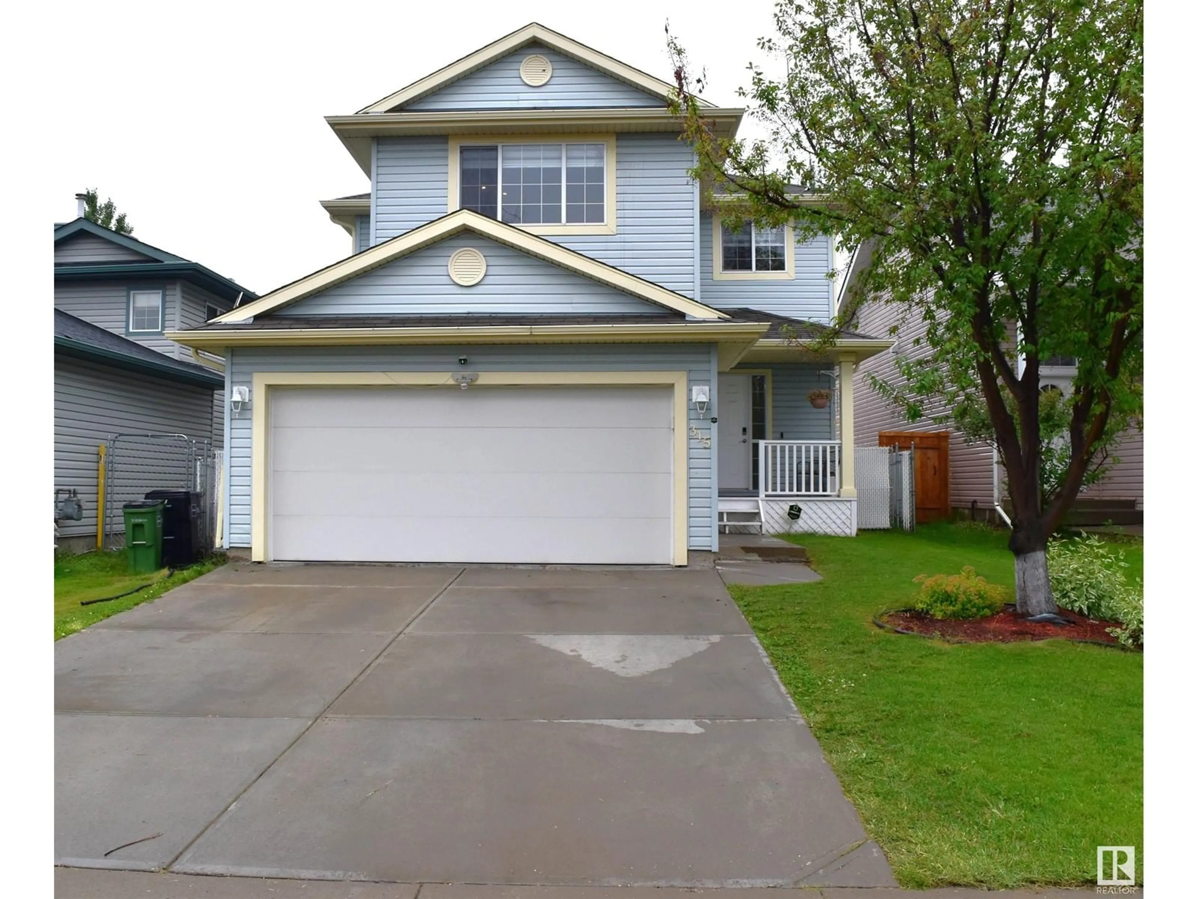 Home with vinyl exterior material, street for 315 WILD ROSE WY, Edmonton Alberta T6T1M7