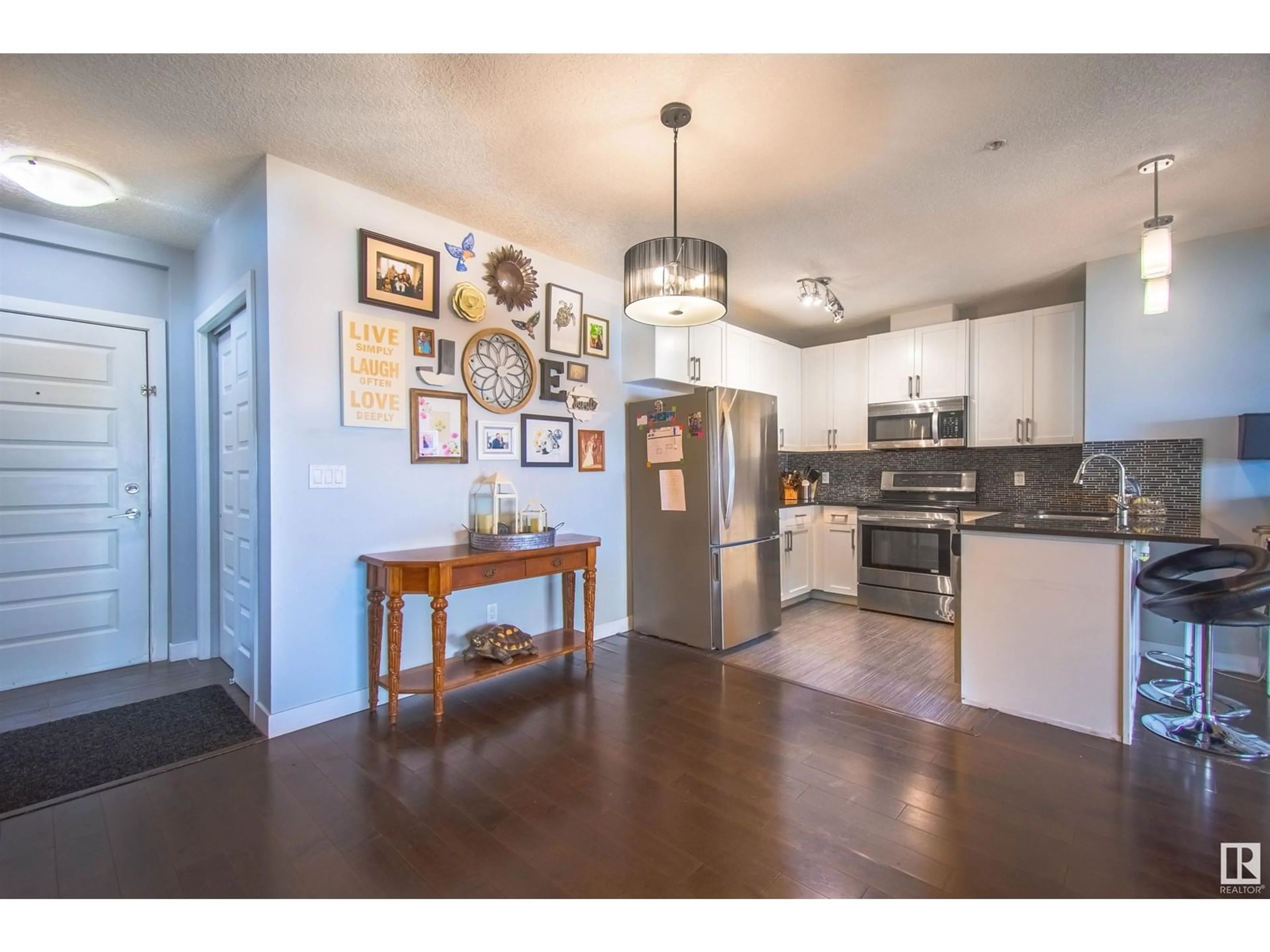 Open concept kitchen, wood/laminate floor for 5151 - 731 WINDERMERE BV, Edmonton Alberta T6W2K4