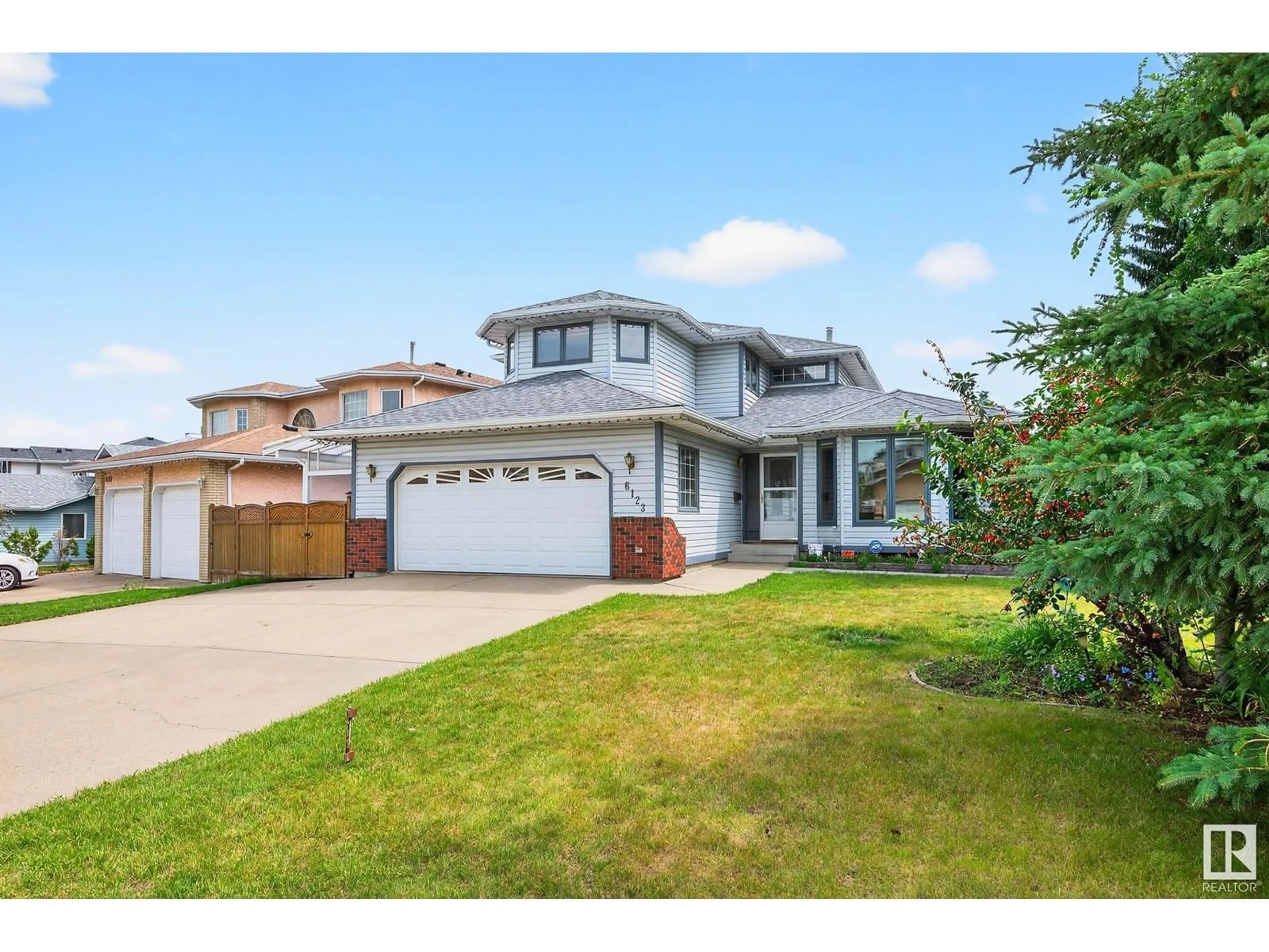 Home with vinyl exterior material, street for 6123 156 AV, Edmonton Alberta T5Y2N1
