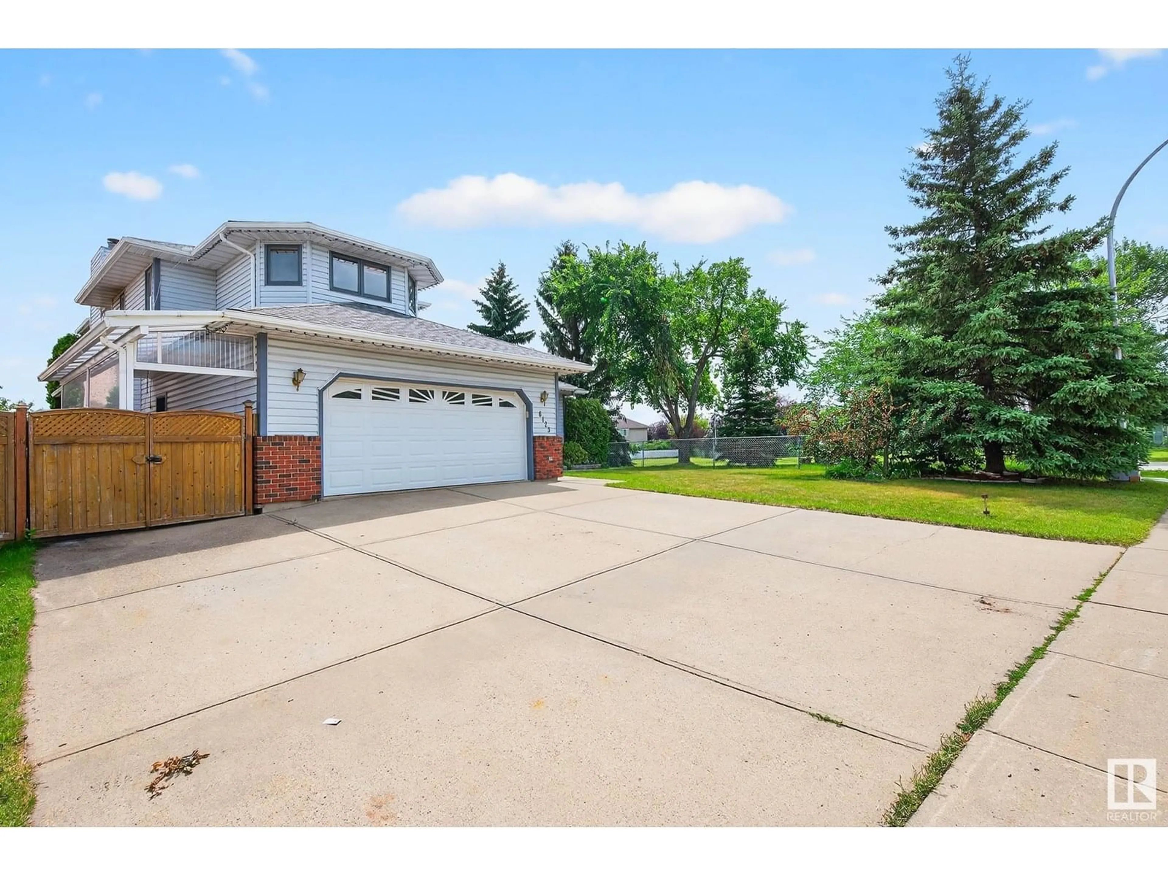 A pic from outside/outdoor area/front of a property/back of a property/a pic from drone, street for 6123 156 AV, Edmonton Alberta T5Y2N1