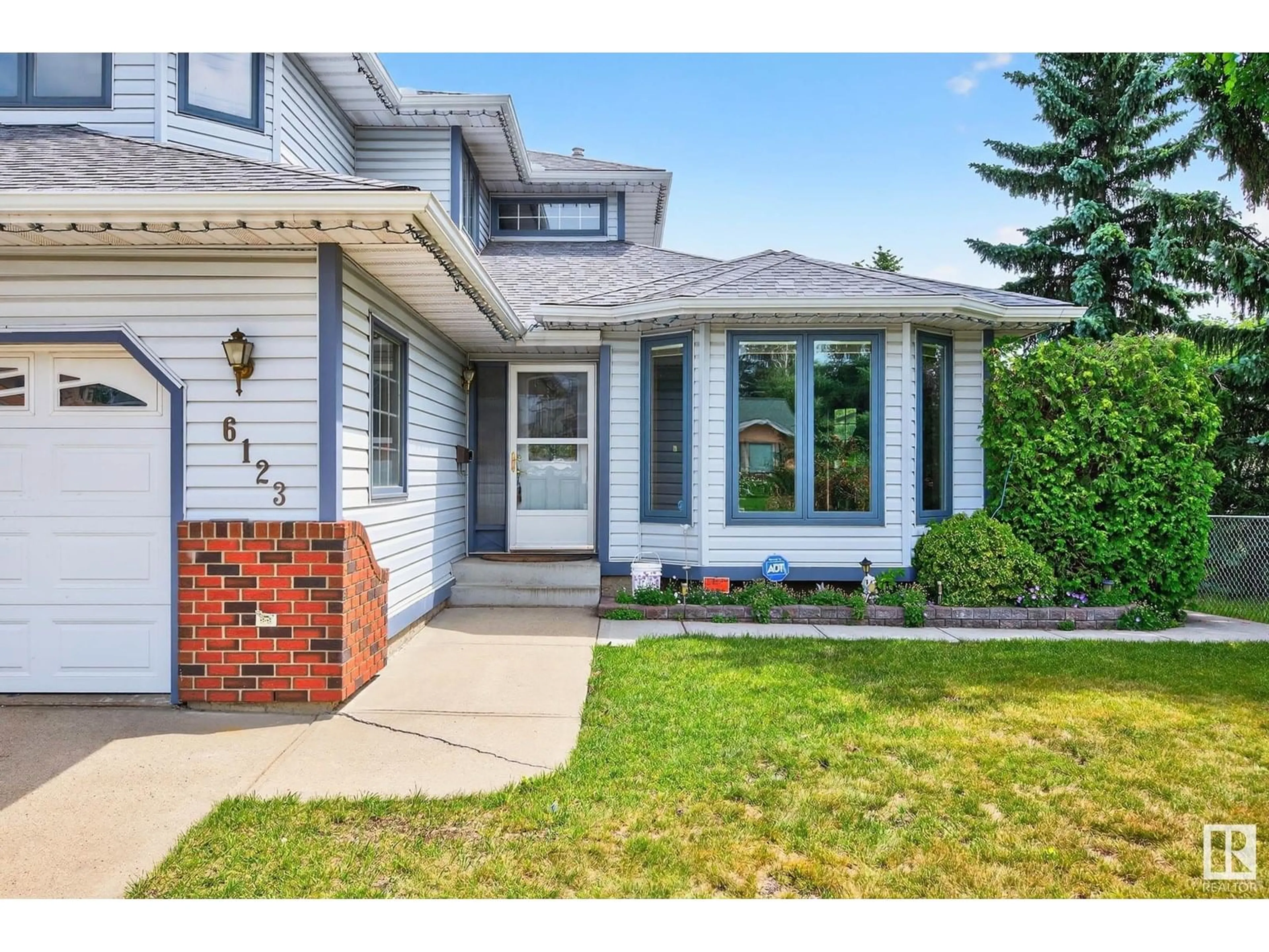 Home with vinyl exterior material, street for 6123 156 AV, Edmonton Alberta T5Y2N1