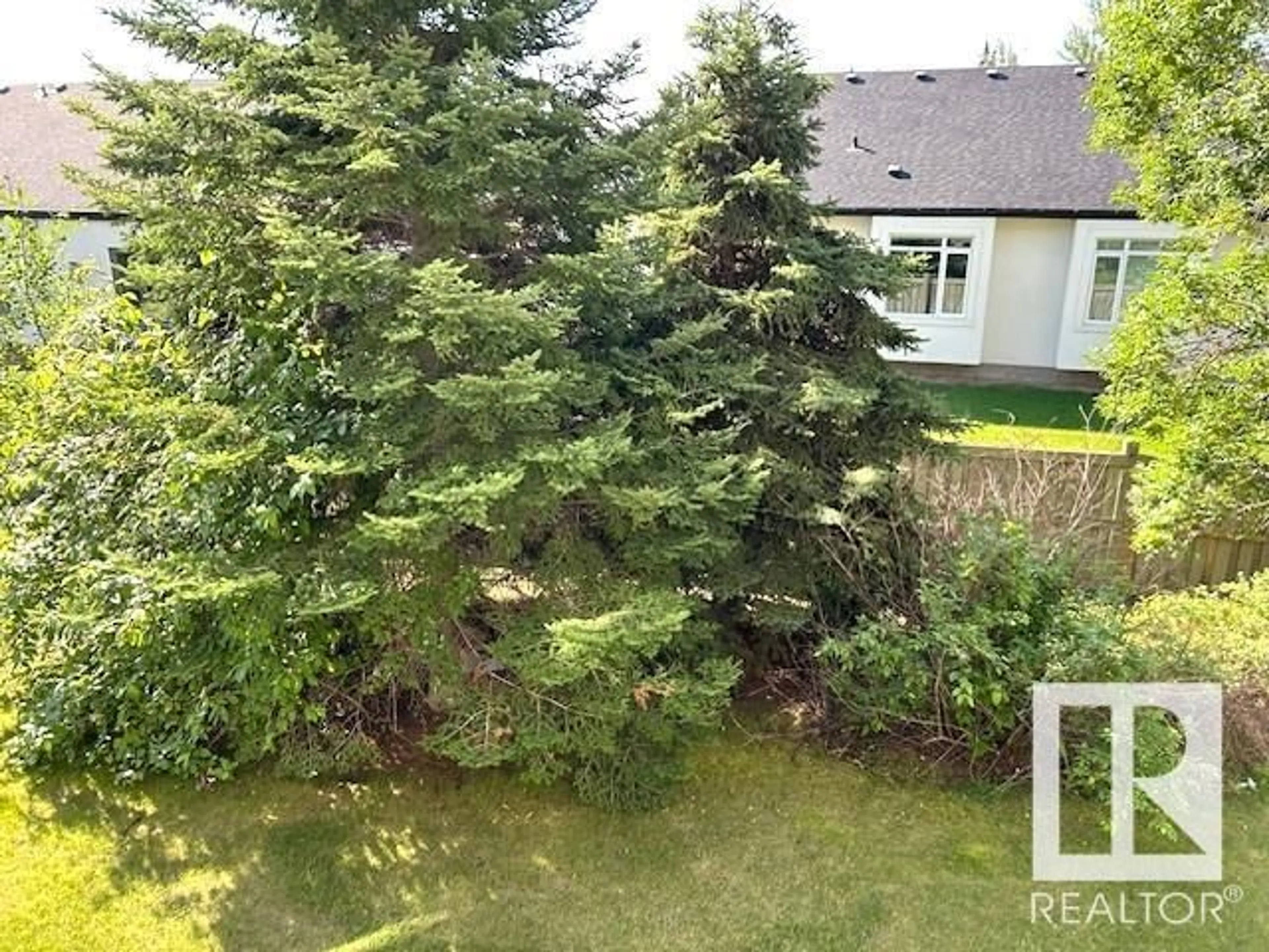 A pic from outside/outdoor area/front of a property/back of a property/a pic from drone, forest/trees view for #212 - 616 MCALLISTER LO, Edmonton Alberta T6W1N1