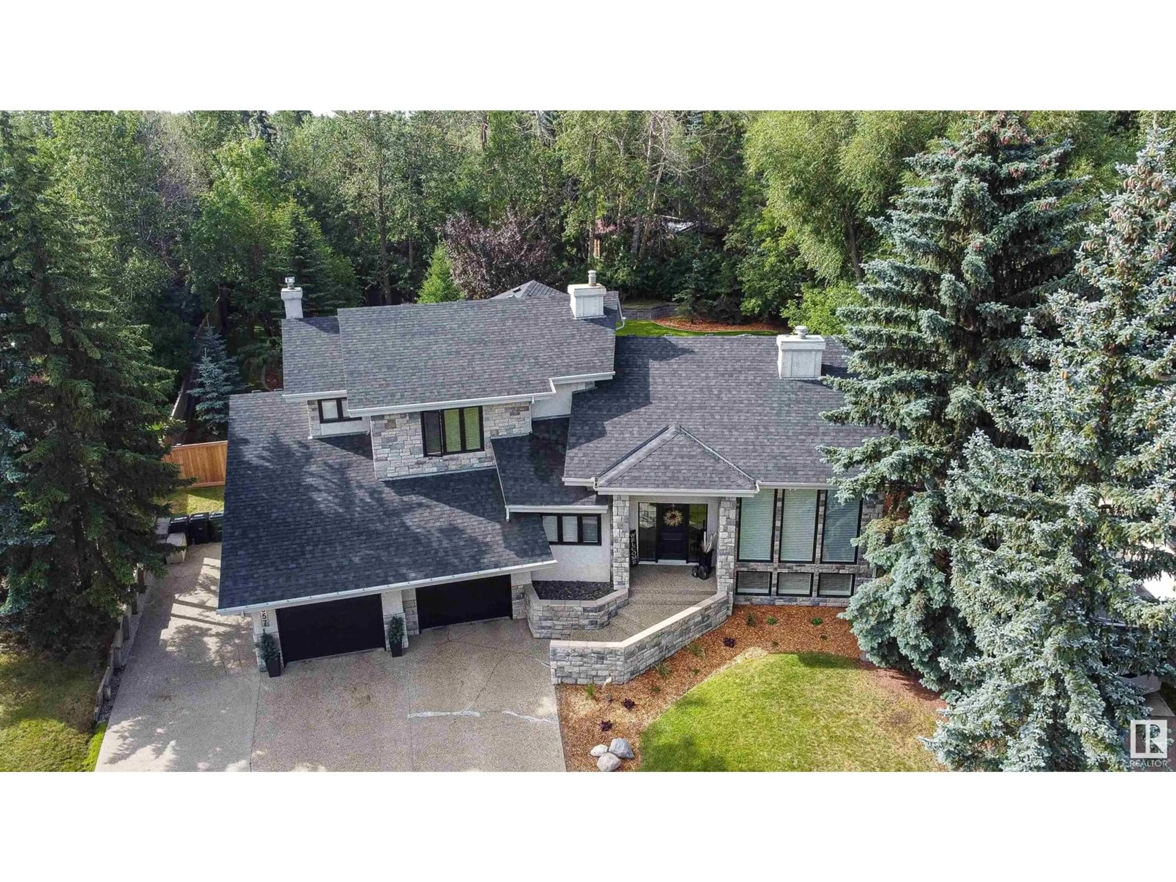 A pic from outside/outdoor area/front of a property/back of a property/a pic from drone, mountain view for 557 ESTATE DR, Sherwood Park Alberta T8B1M2