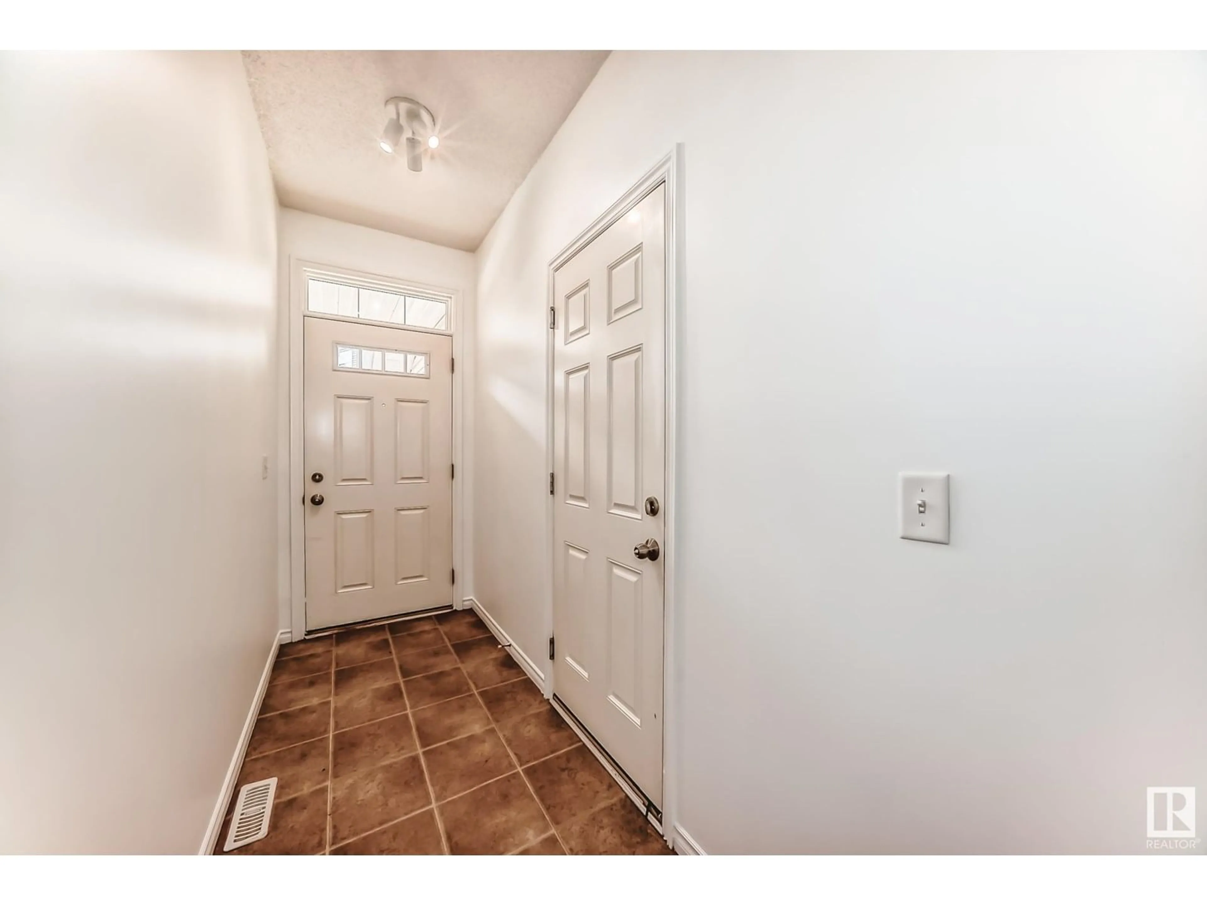 Indoor entryway for #102 - 3010 33 AV, Edmonton Alberta T6T0C3