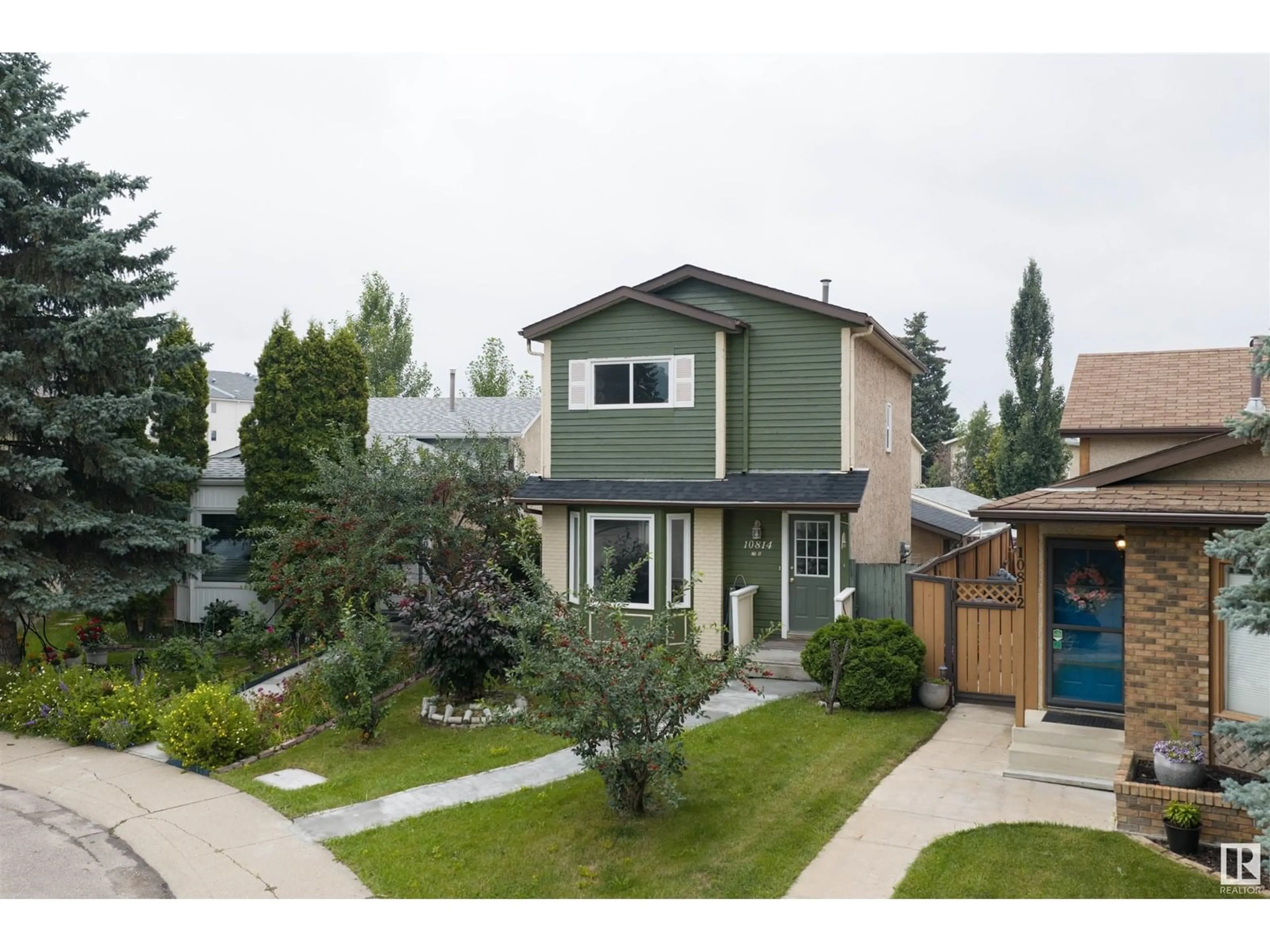 Home with vinyl exterior material, street for 10814 20A AV, Edmonton Alberta T6J5T3