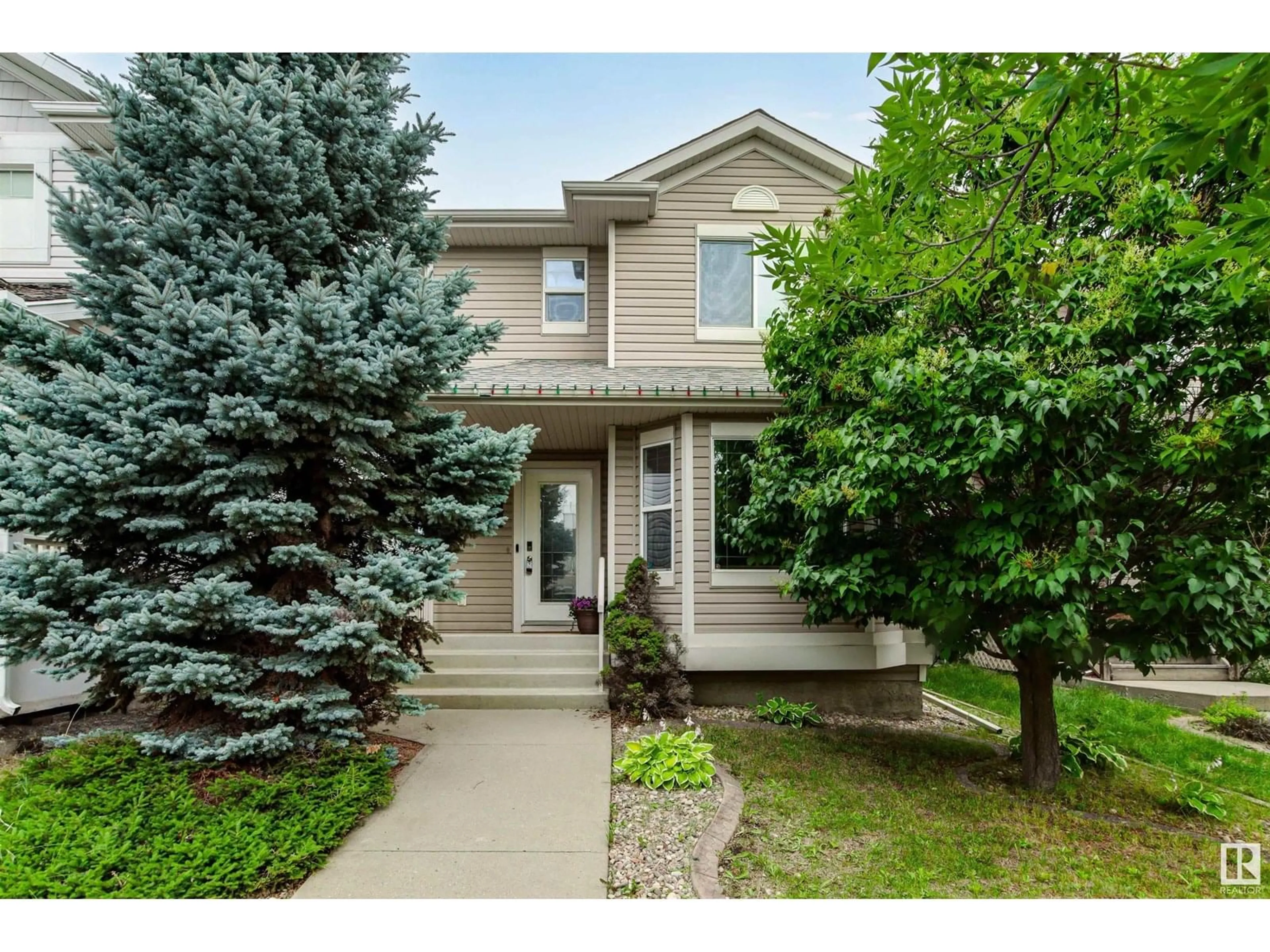 Home with vinyl exterior material, street for 21236 91 AV, Edmonton Alberta T5T0W4