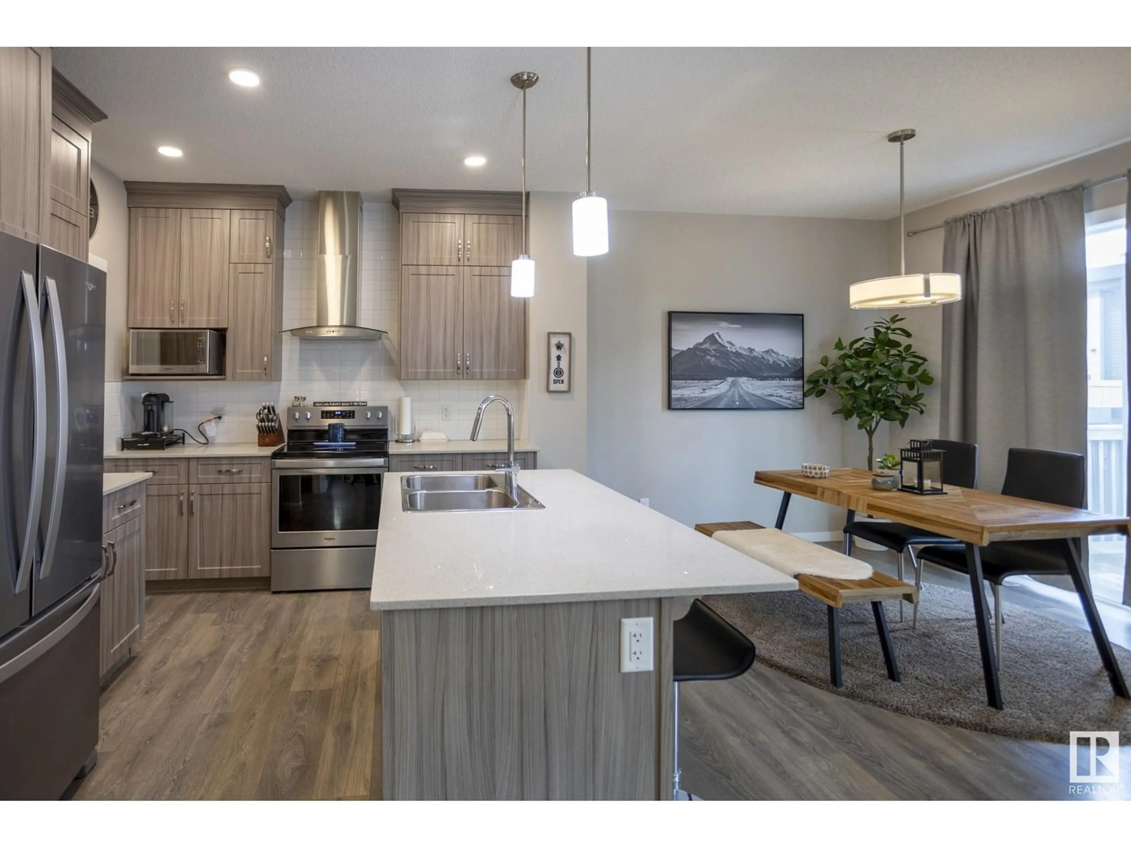 Open concept kitchen, wood/laminate floor for SW - 3338 CHECKNITA CM, Edmonton Alberta T6W4E9