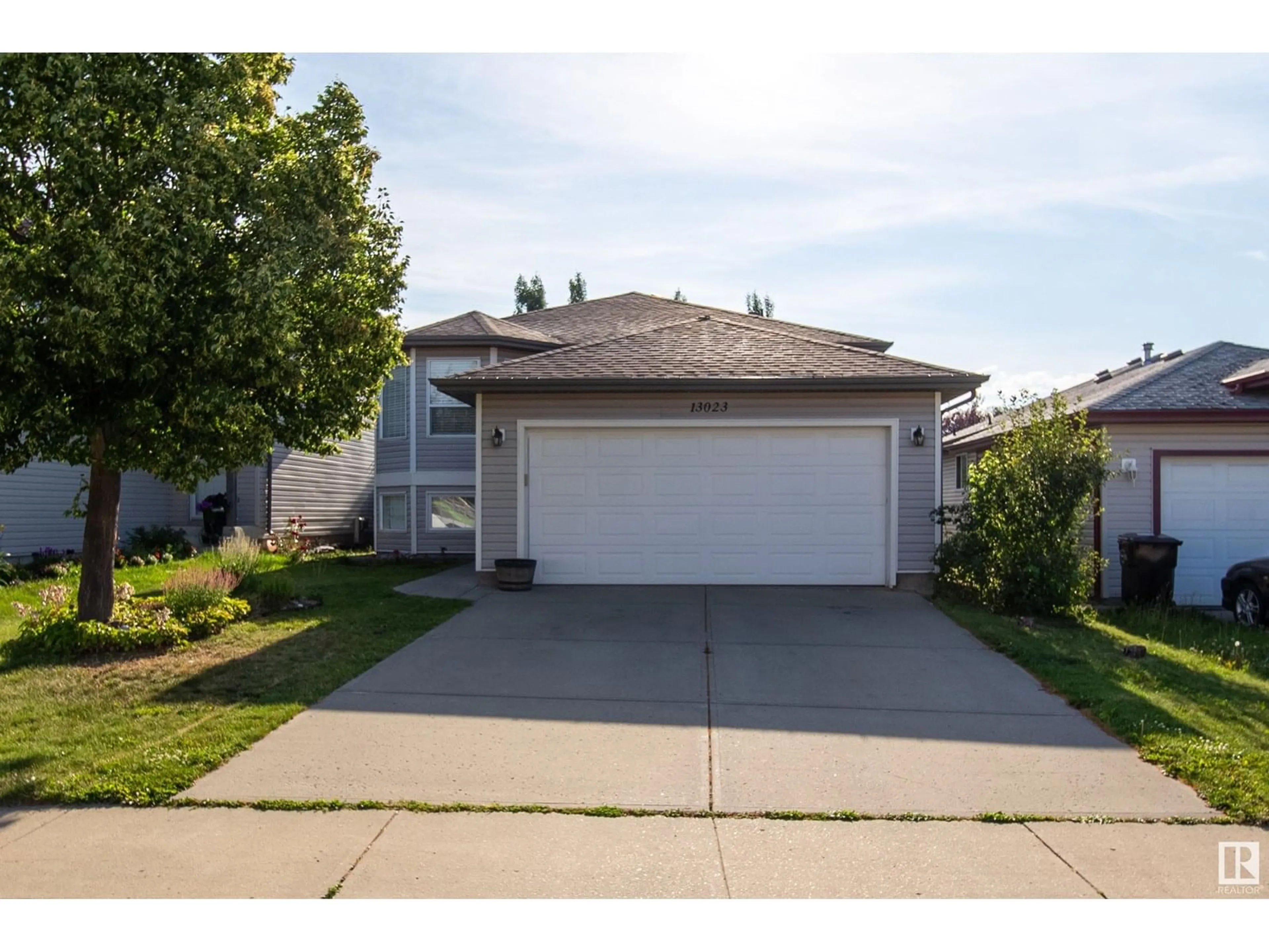 Home with vinyl exterior material, street for NW - 13023 35 ST, Edmonton Alberta T5A5C8