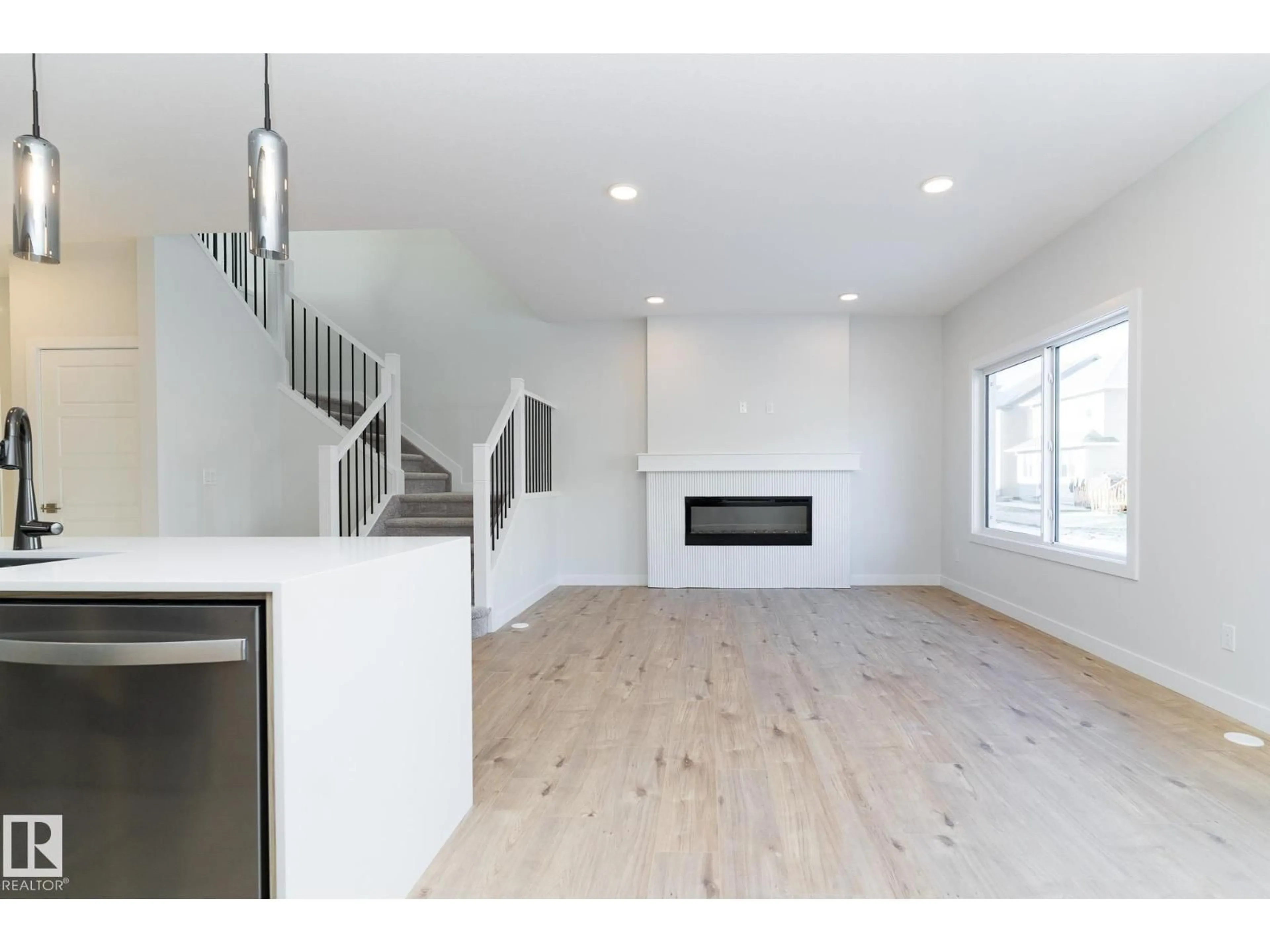 Open concept kitchen, wood/laminate floor for 3038 DIXON LANDING LD, Edmonton Alberta T6W5L2