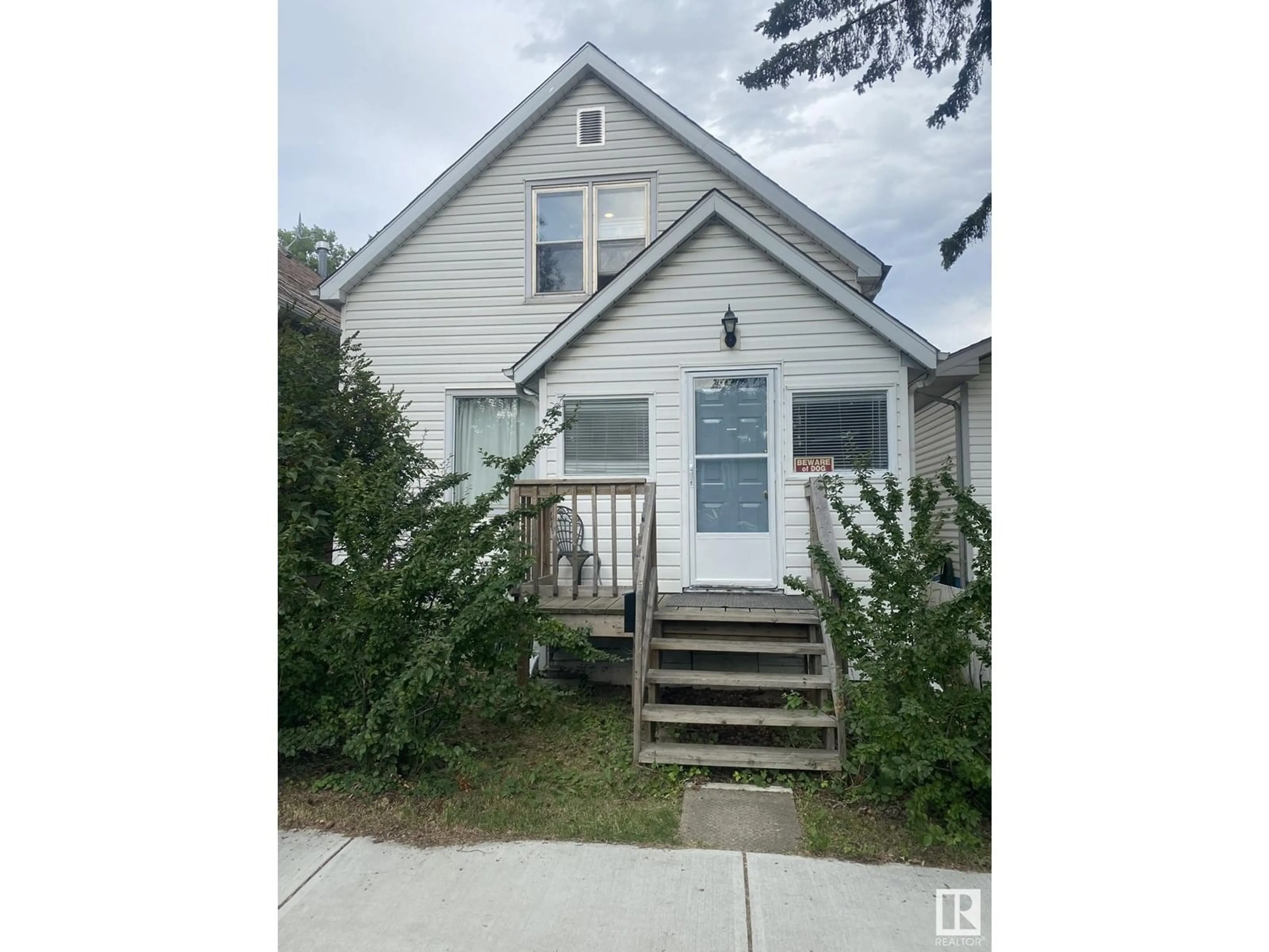 Home with vinyl exterior material, street for NW - 12811 121 ST, Edmonton Alberta T5L0B1