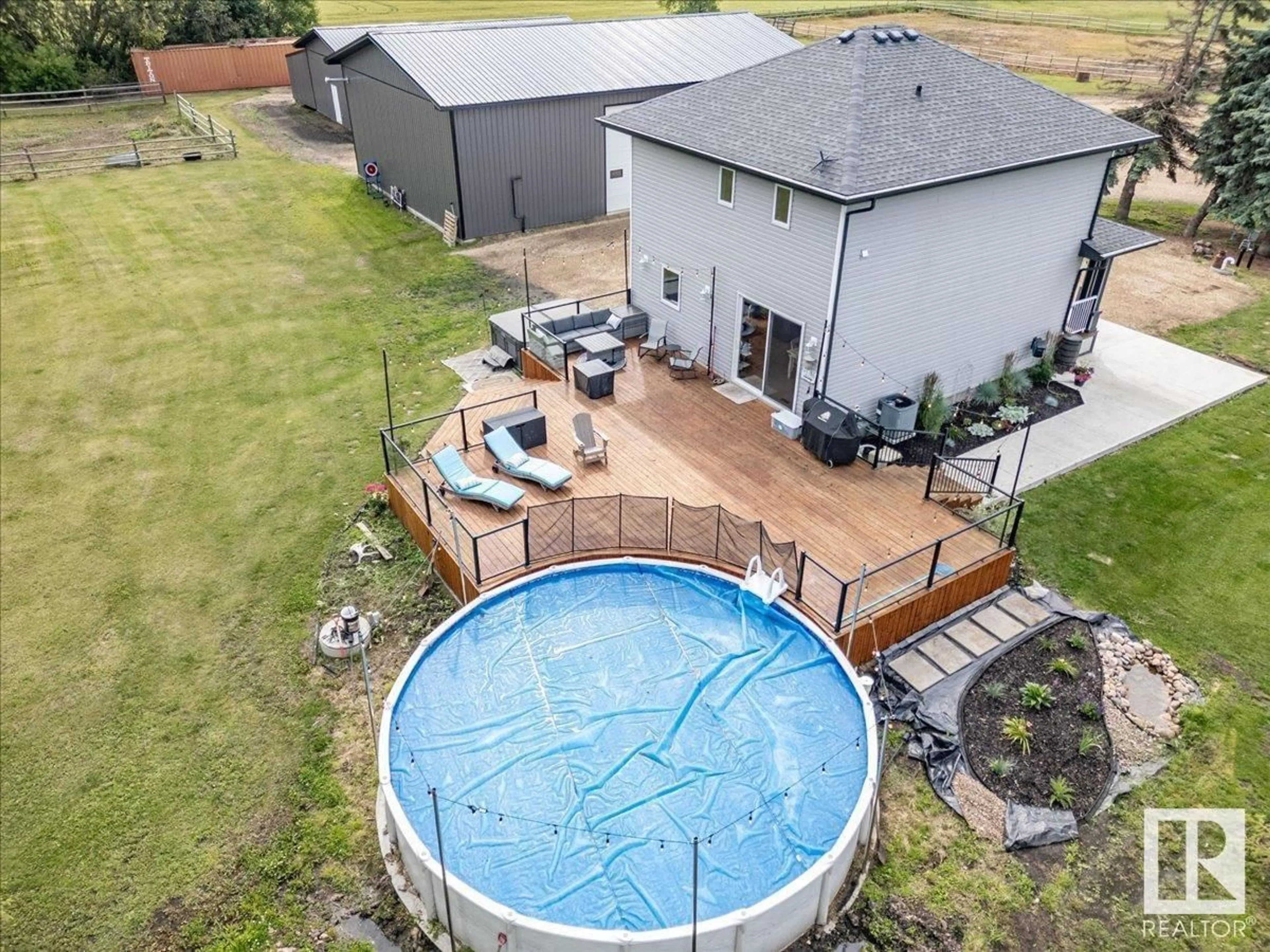 A pic from outside/outdoor area/front of a property/back of a property/a pic from drone, water/lake/river/ocean view for 48515 RGE ROAD 274, Rural Leduc County Alberta T0C0V0