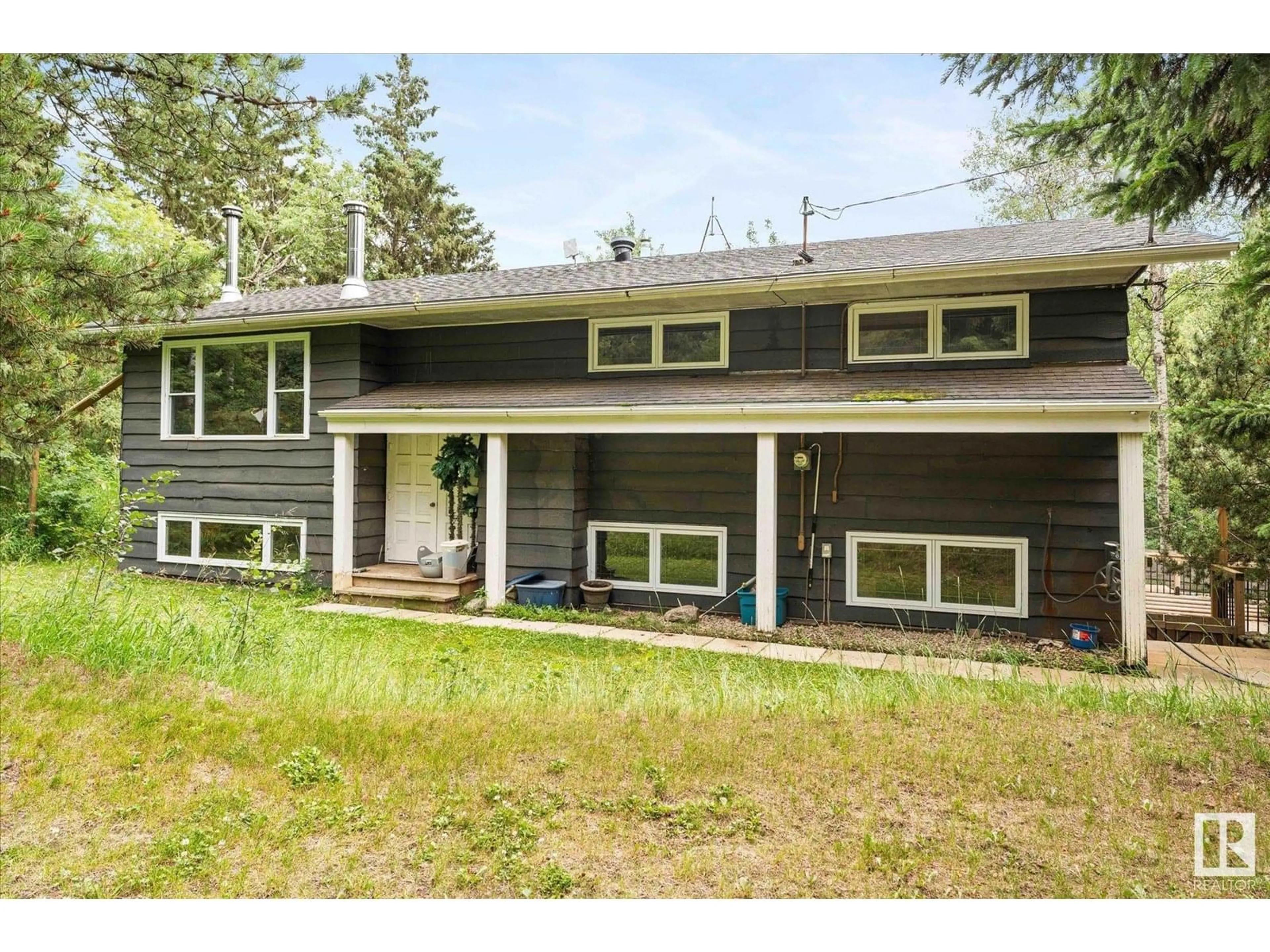Home with vinyl exterior material, street for 53027 RGE ROAD 20, Rural Parkland County Alberta T7Y2G8