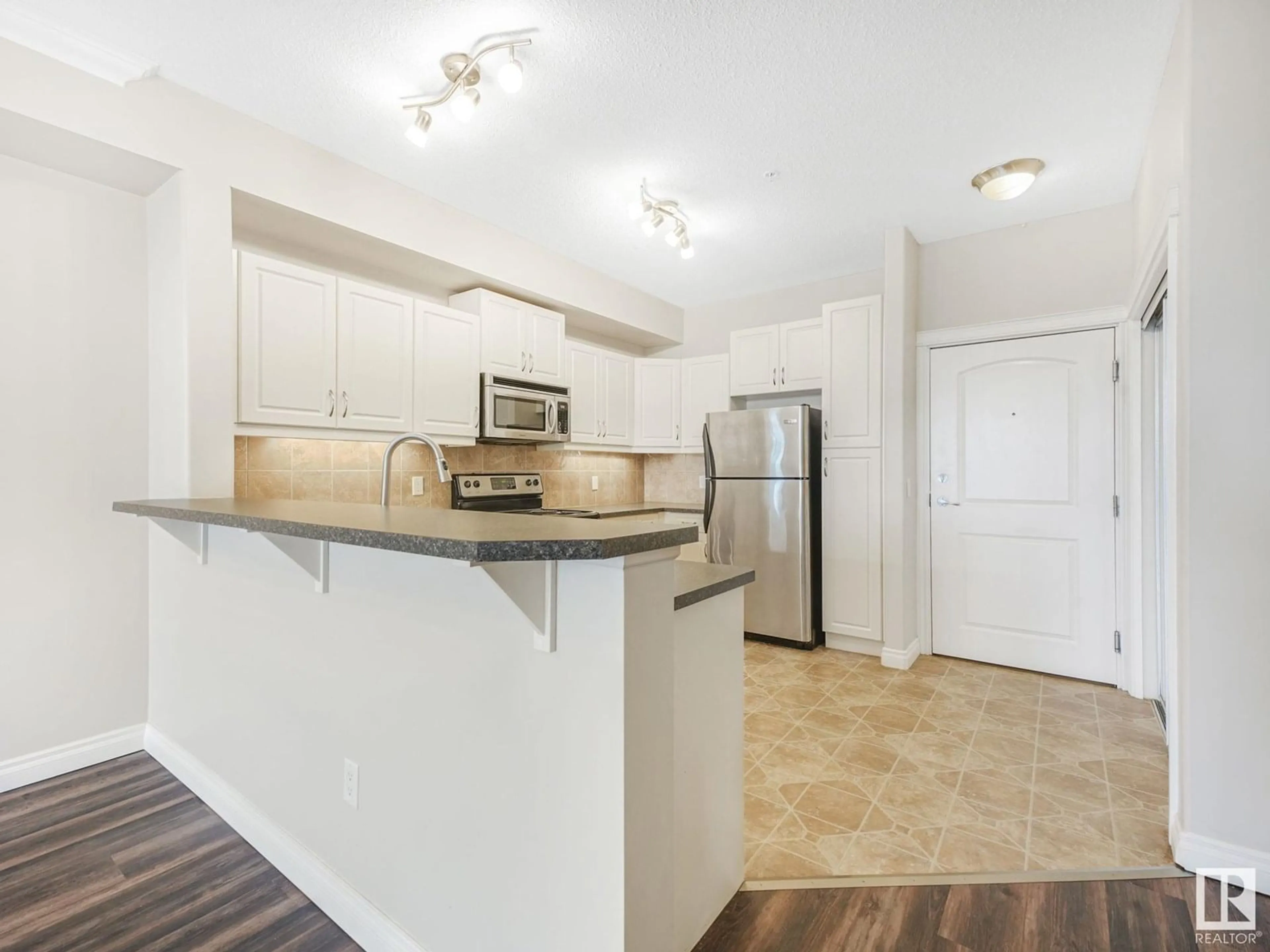Open concept kitchen, unknown for #312 - 12408 15 AV, Edmonton Alberta T6W1X2