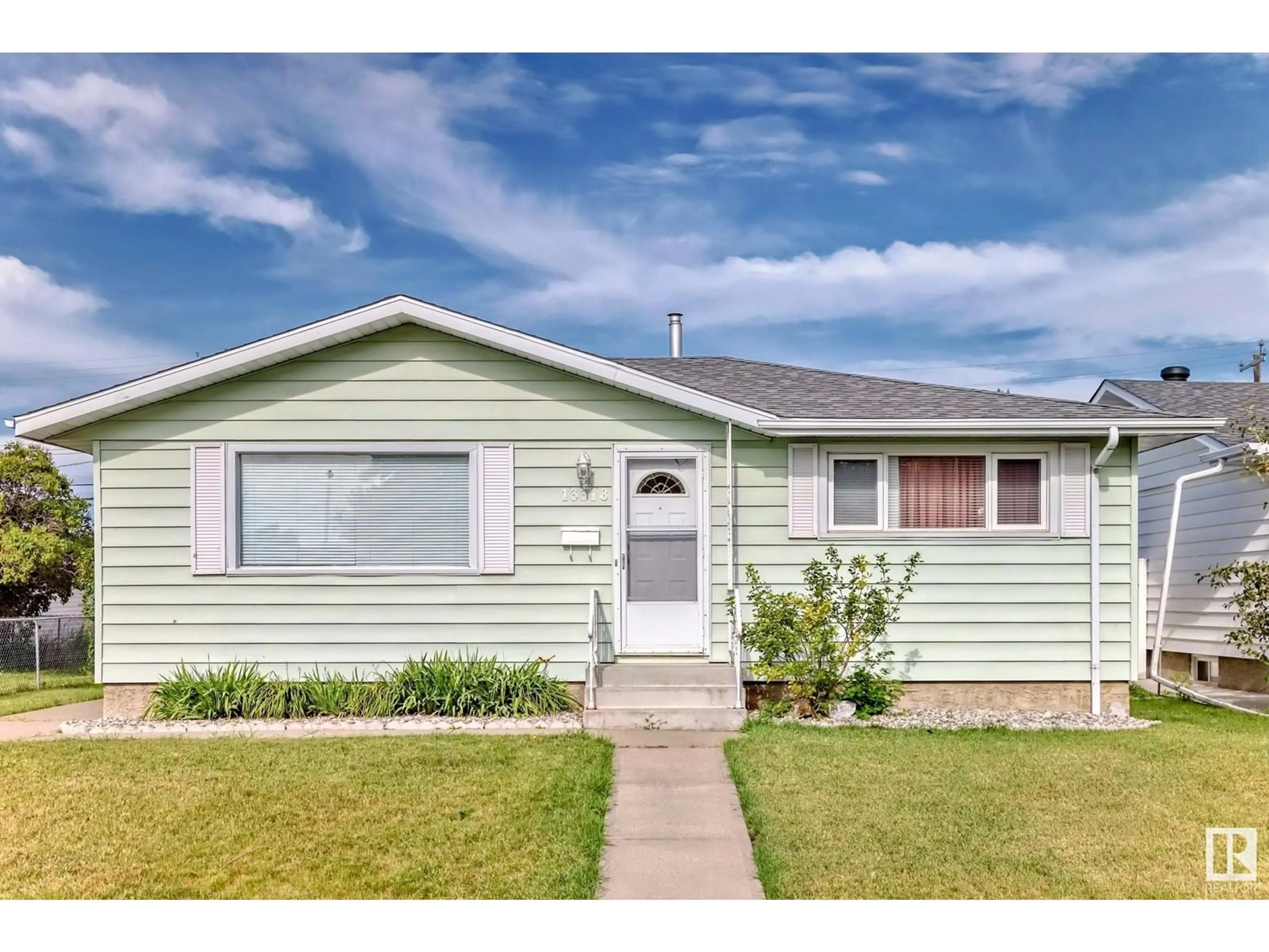 Home with vinyl exterior material, street for 13318 91 ST, Edmonton Alberta T5E3P8