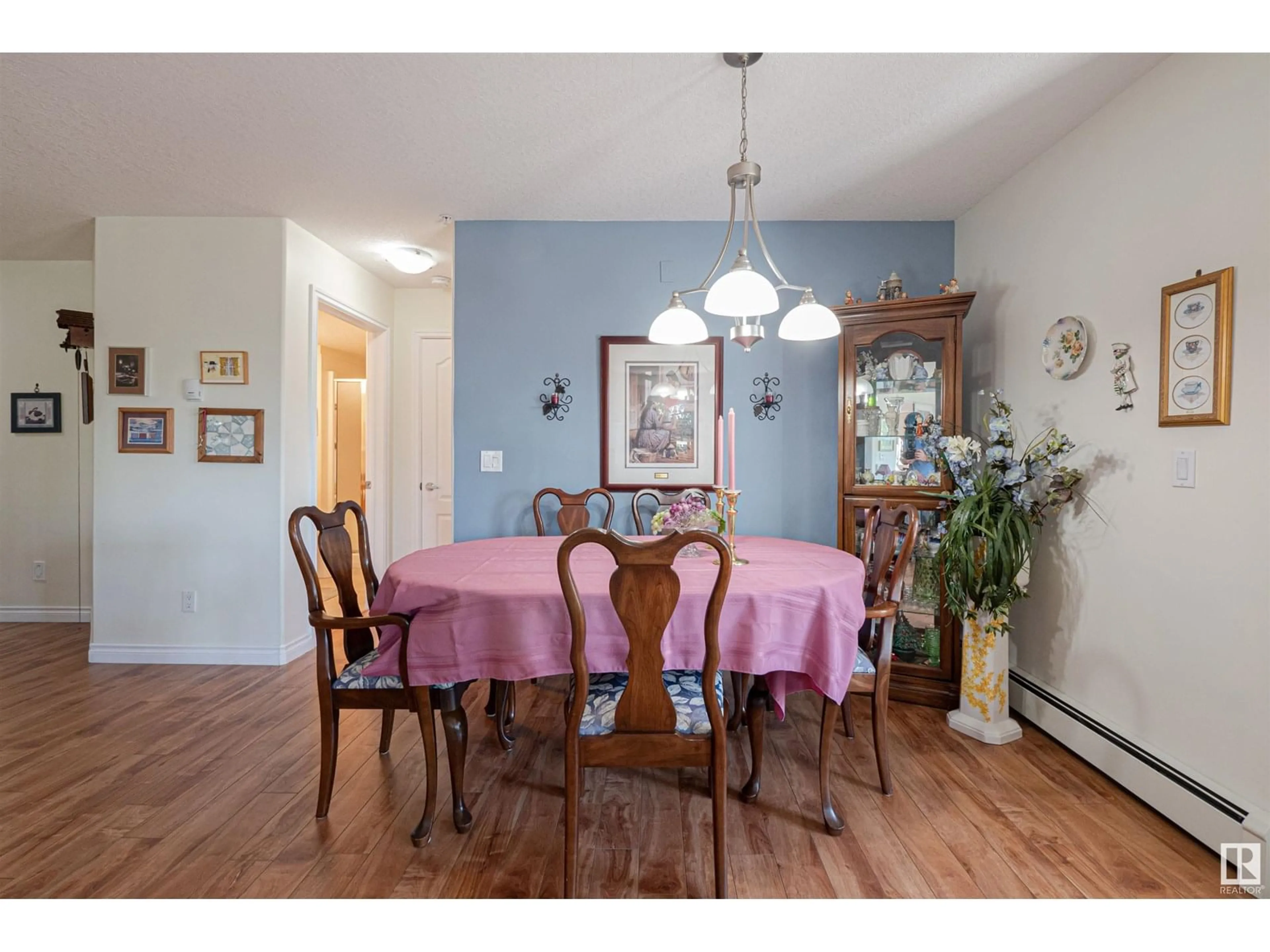 Dining room, wood/laminate floor for #212 - 9995 93 AV, Fort Saskatchewan Alberta T8L1N5