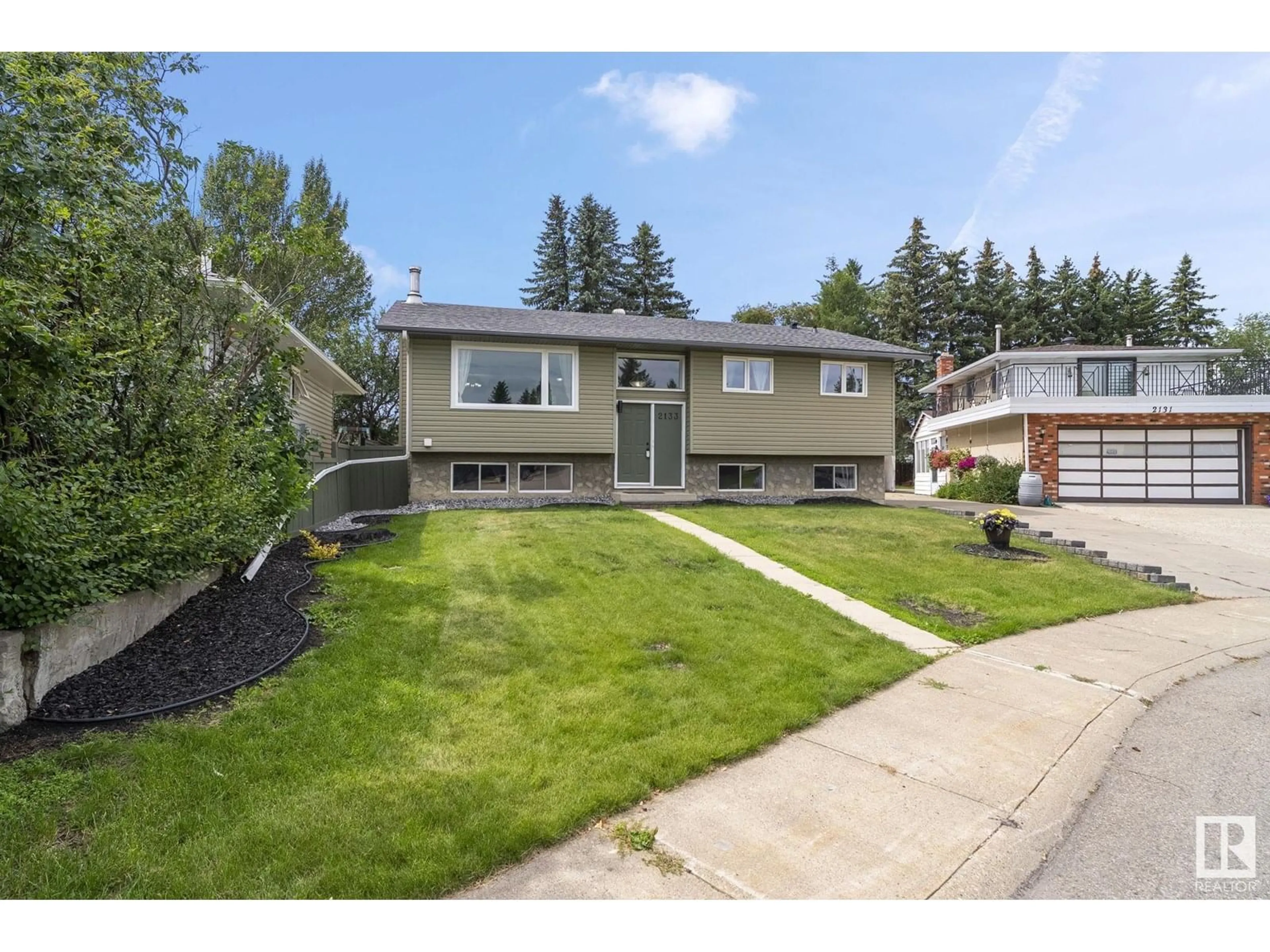 Home with vinyl exterior material, street for NW - 2133 85 ST, Edmonton Alberta T6K2G1