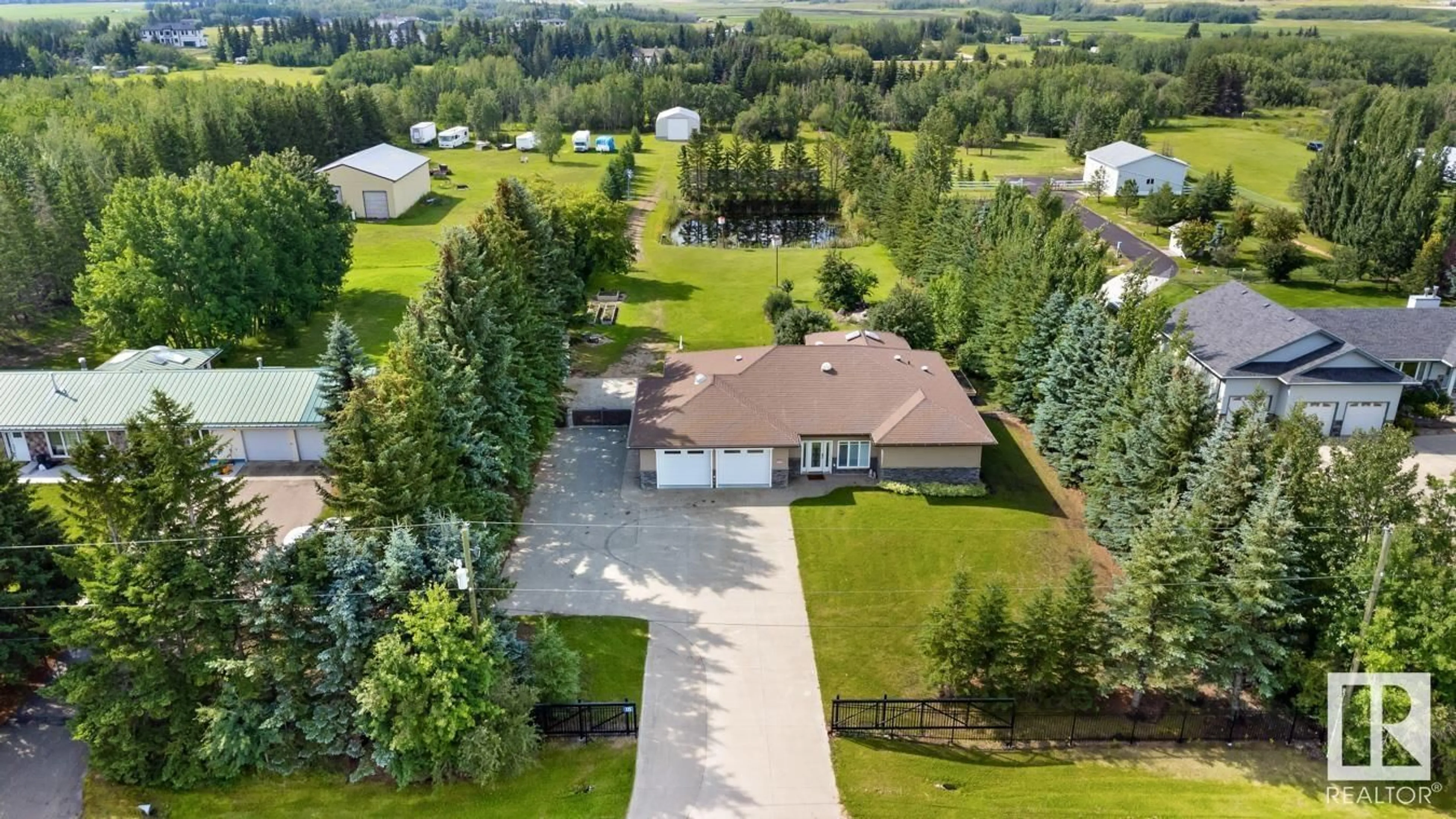 A pic from outside/outdoor area/front of a property/back of a property/a pic from drone, unknown for 115 - 50512 RGE ROAD 245, Rural Leduc County Alberta T4X0P5