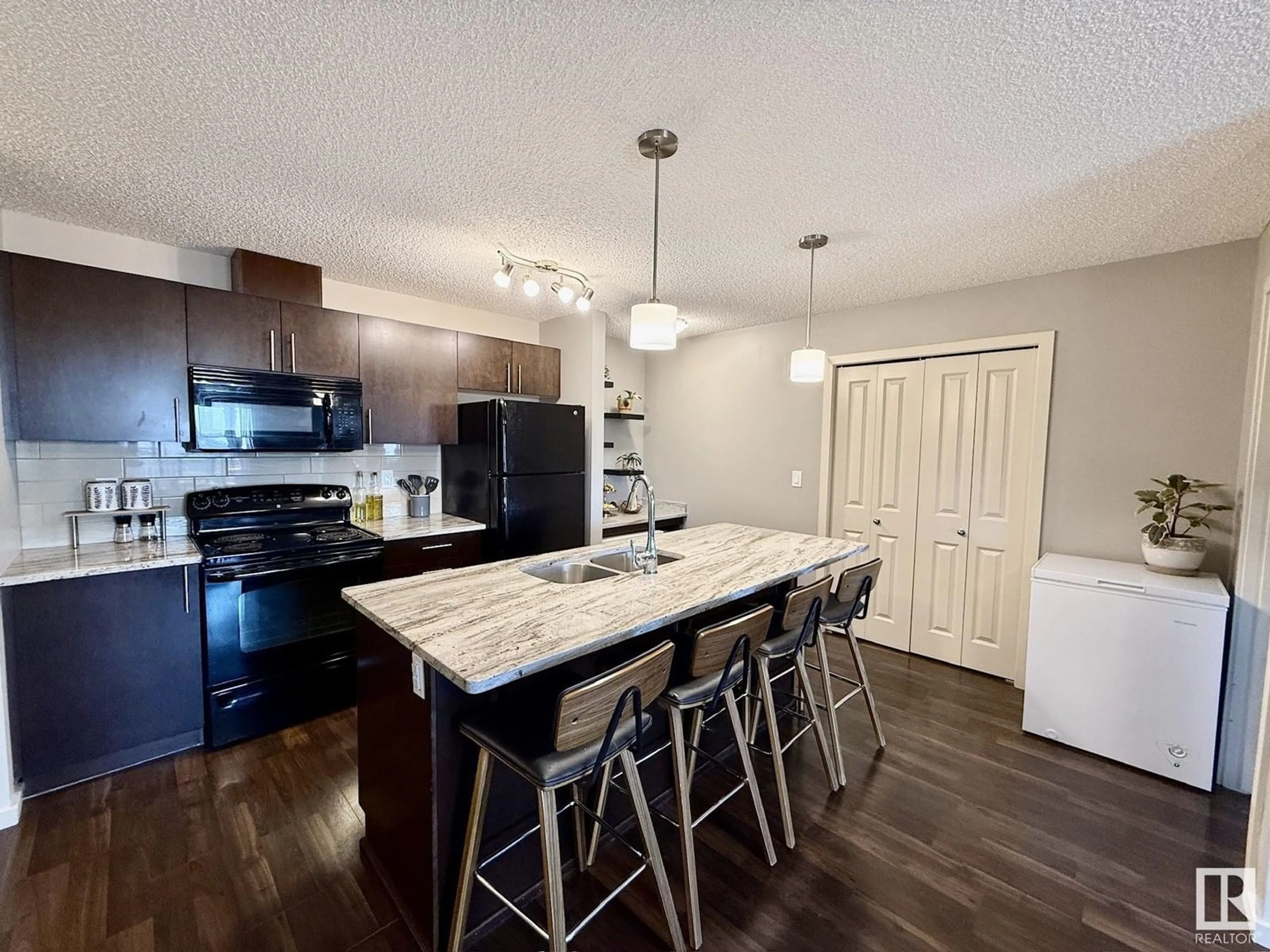 Open concept kitchen, unknown for #402 - 3353 16A AV, Edmonton Alberta T6T0V4