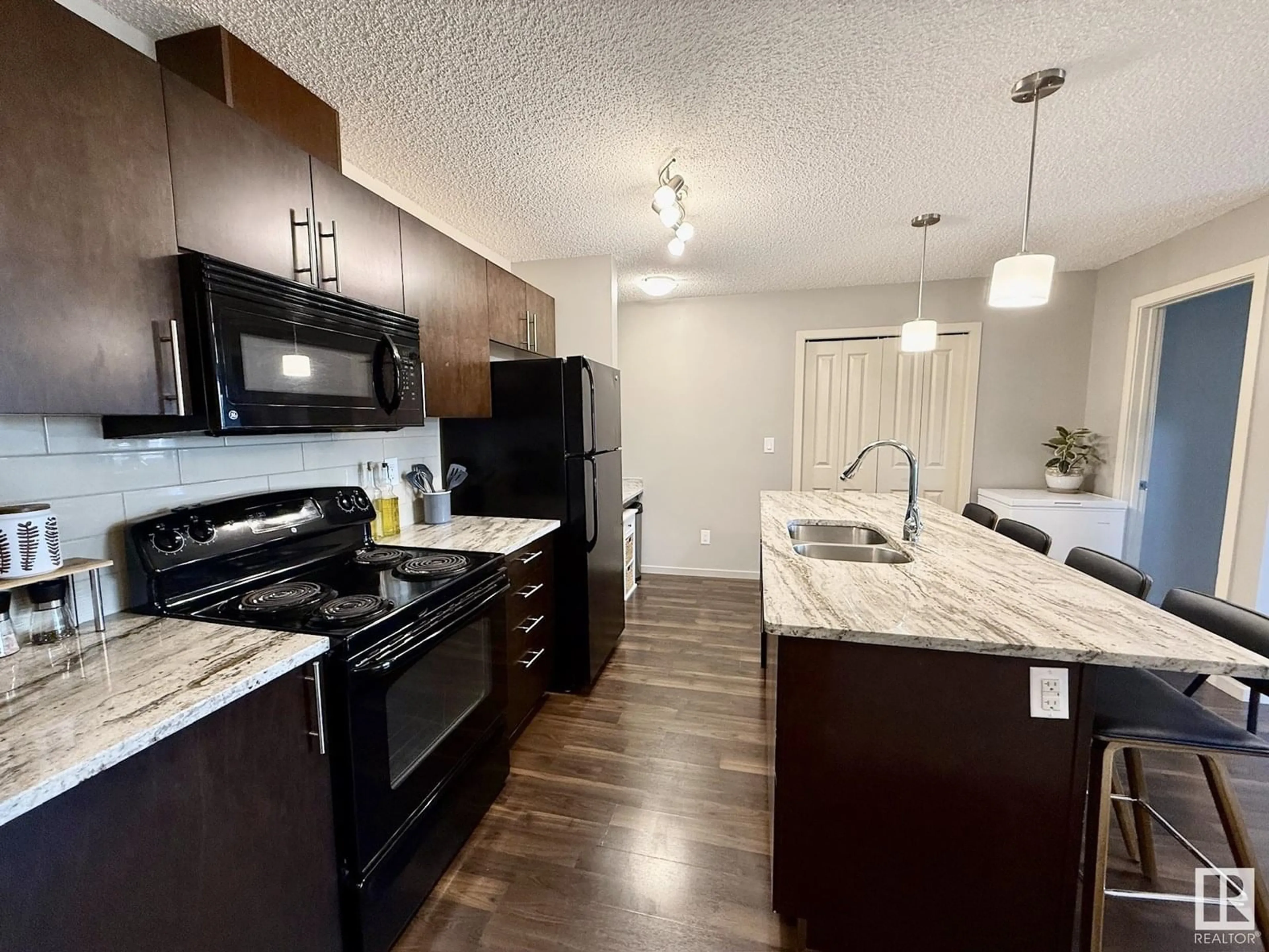 Open concept kitchen, unknown for #402 - 3353 16A AV, Edmonton Alberta T6T0V4
