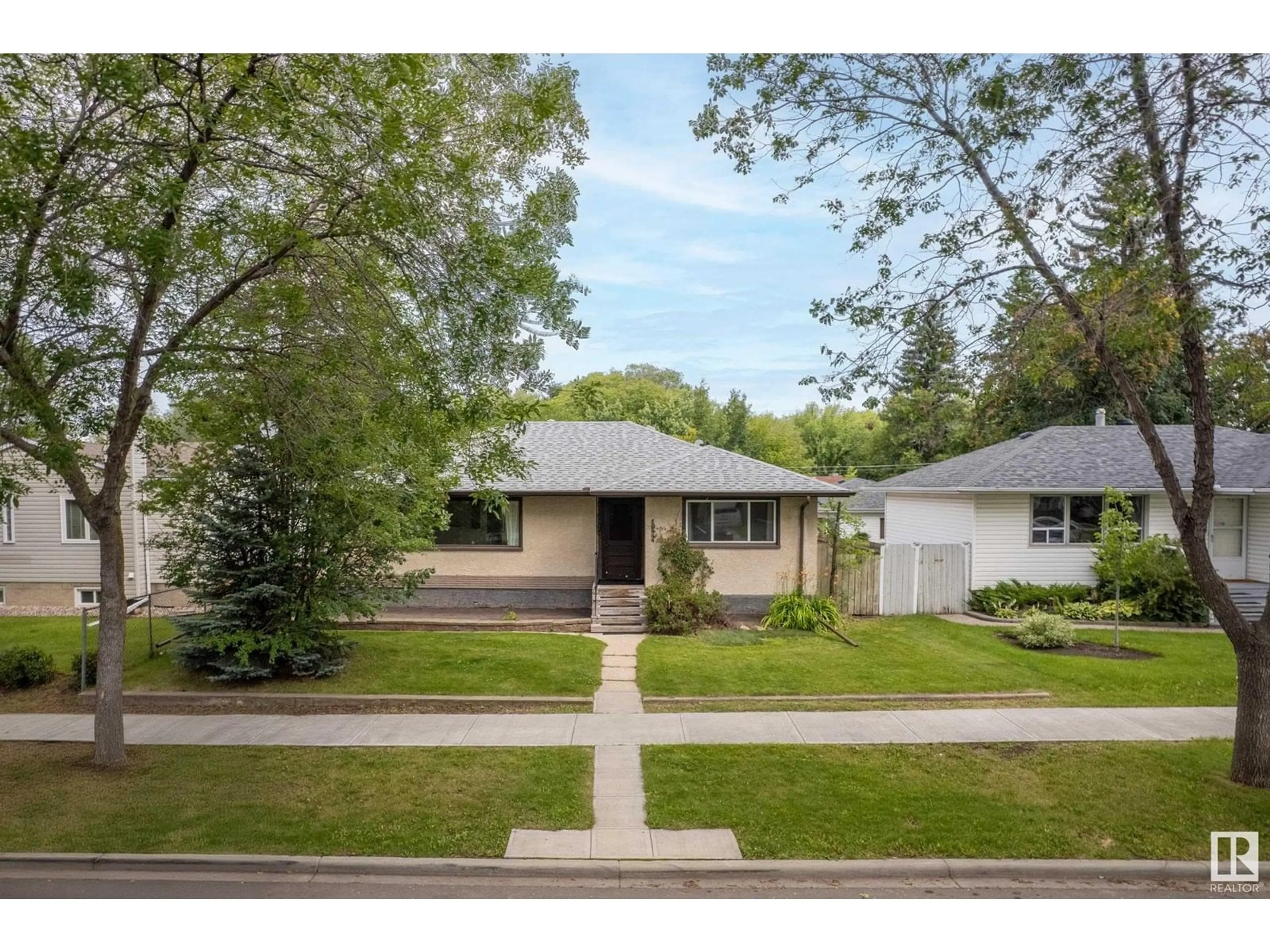 Home with vinyl exterior material, street for 10444 64 AV, Edmonton Alberta T6H1S7