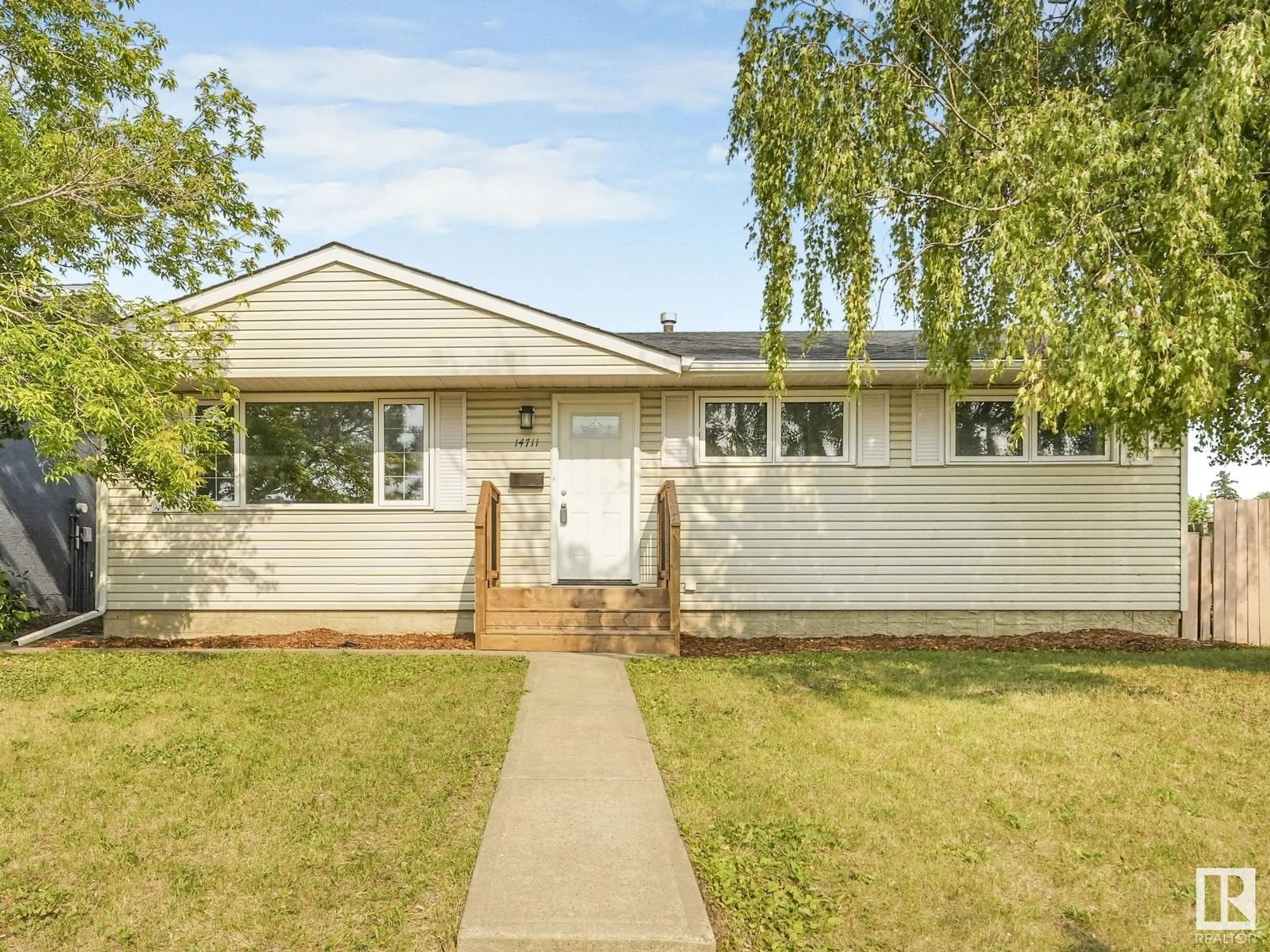 Home with vinyl exterior material, street for 14711 73 ST, Edmonton Alberta T5C0V7