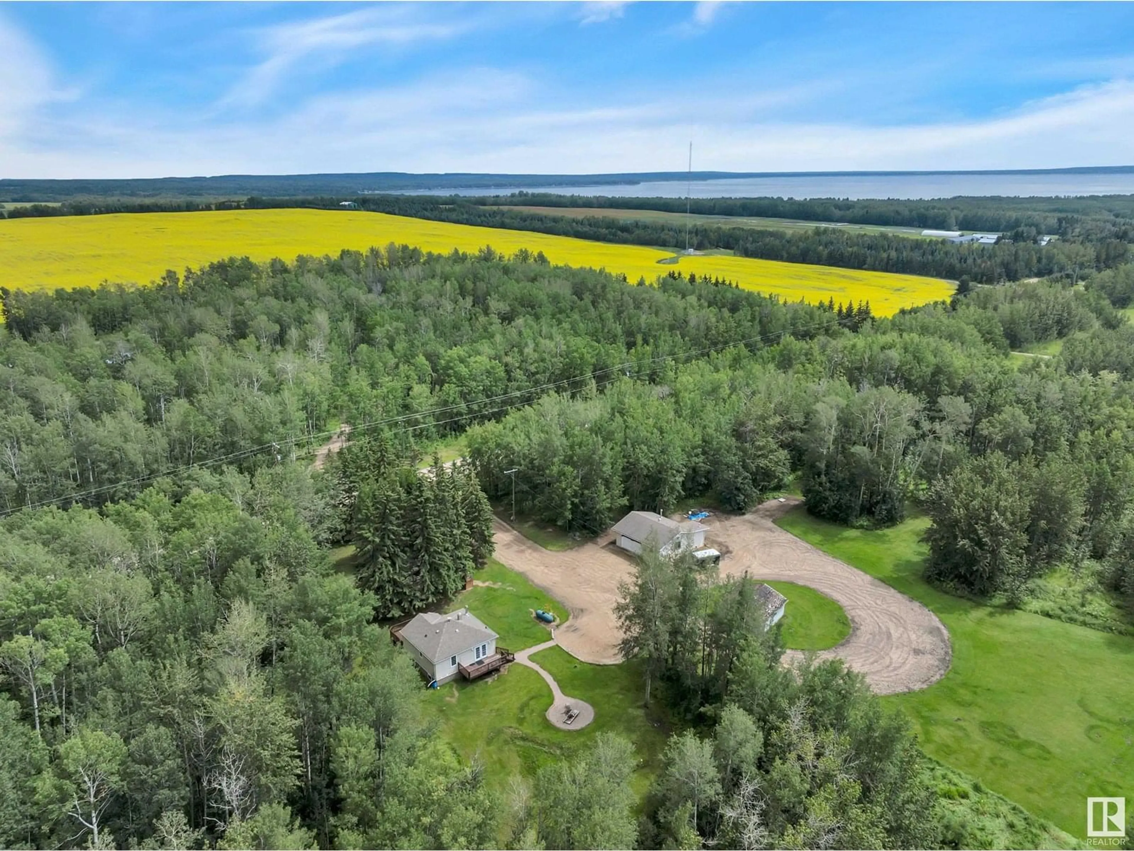 A pic from outside/outdoor area/front of a property/back of a property/a pic from drone, forest/trees view for 47332 RGE ROAD 12, Rural Leduc County Alberta T0C2P0