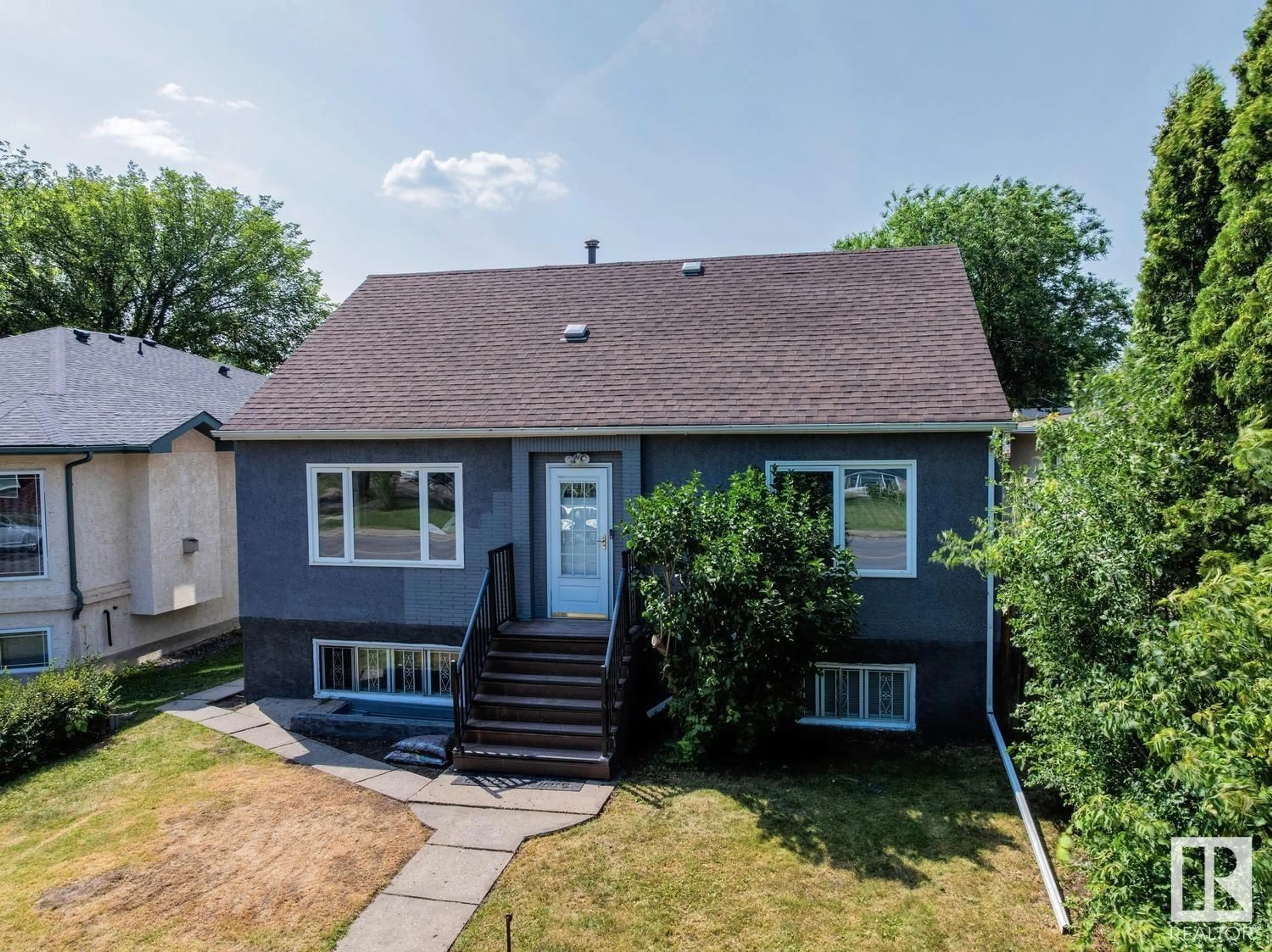 Home with vinyl exterior material, street for NW - 10208 79 ST, Edmonton Alberta T6A3G5