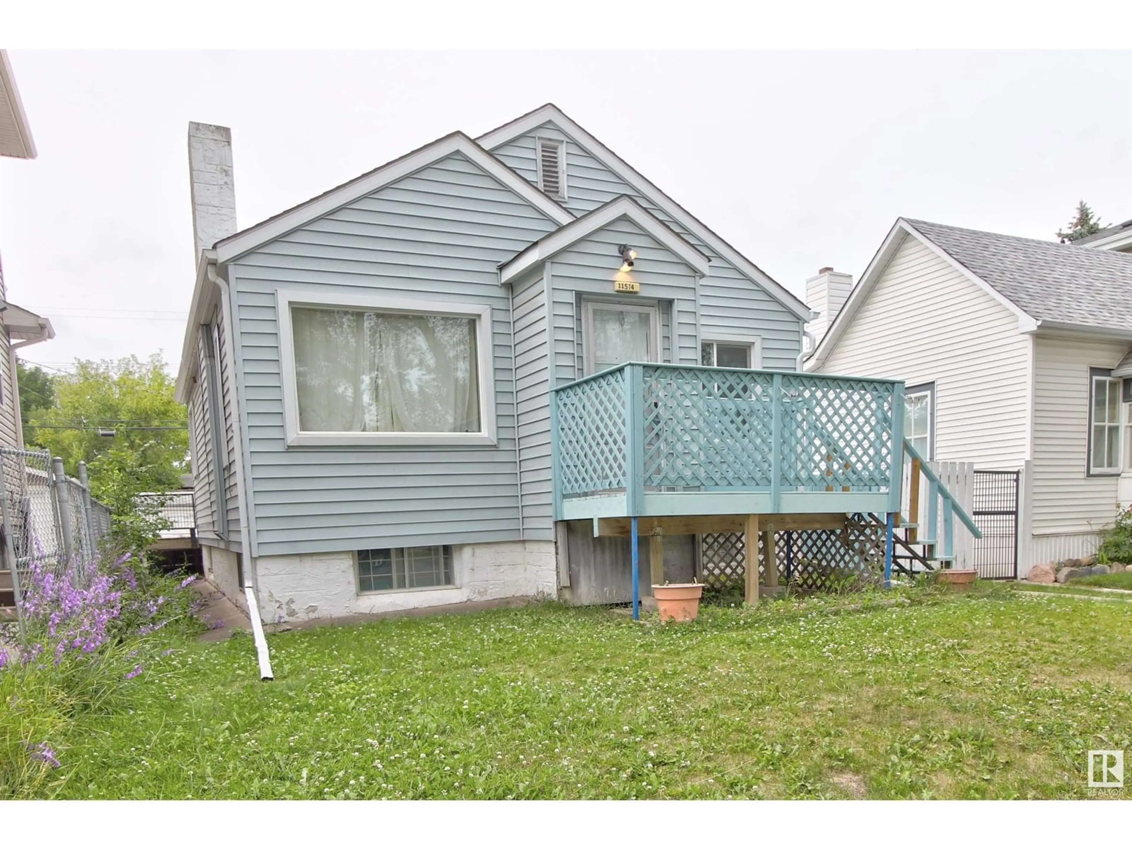 Home with vinyl exterior material, street for 11514 92 ST, Edmonton Alberta T5G0Z7