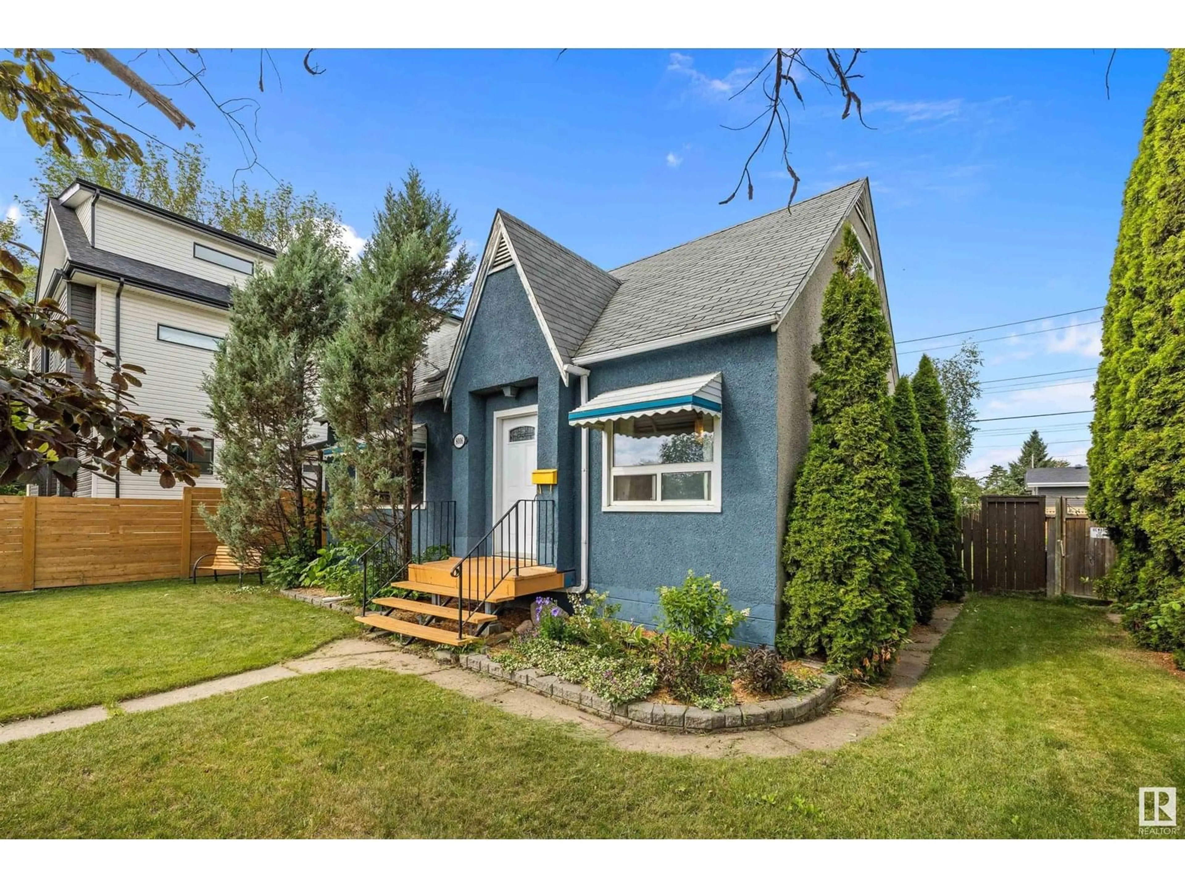 Home with vinyl exterior material, street for 8006 75 ST, Edmonton Alberta T6C2G7
